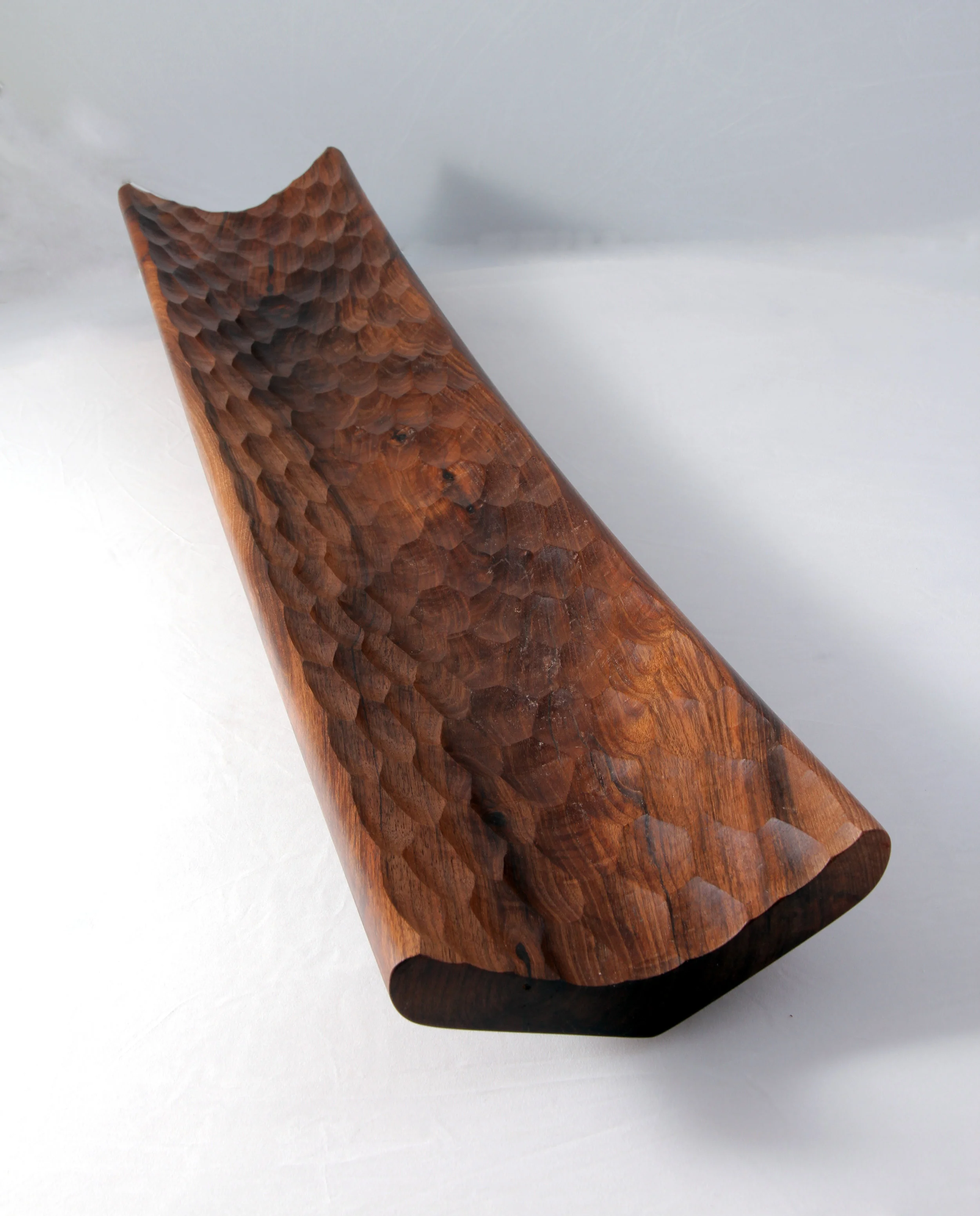  A small boat shaped vessel made from the clients own walnut tree. 