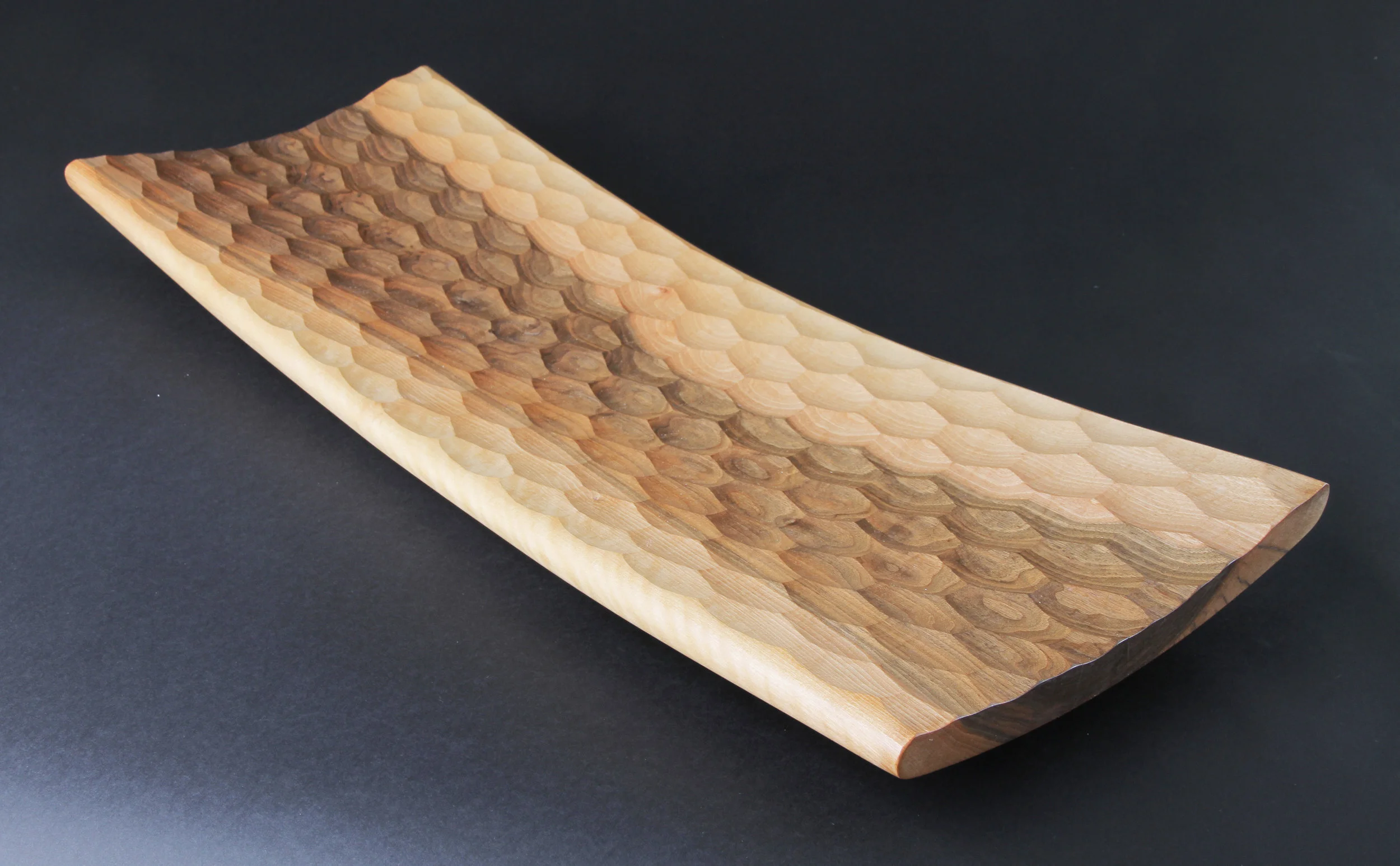  A long faceted walnut vessel made from a green log while the sapwood is still blonde 