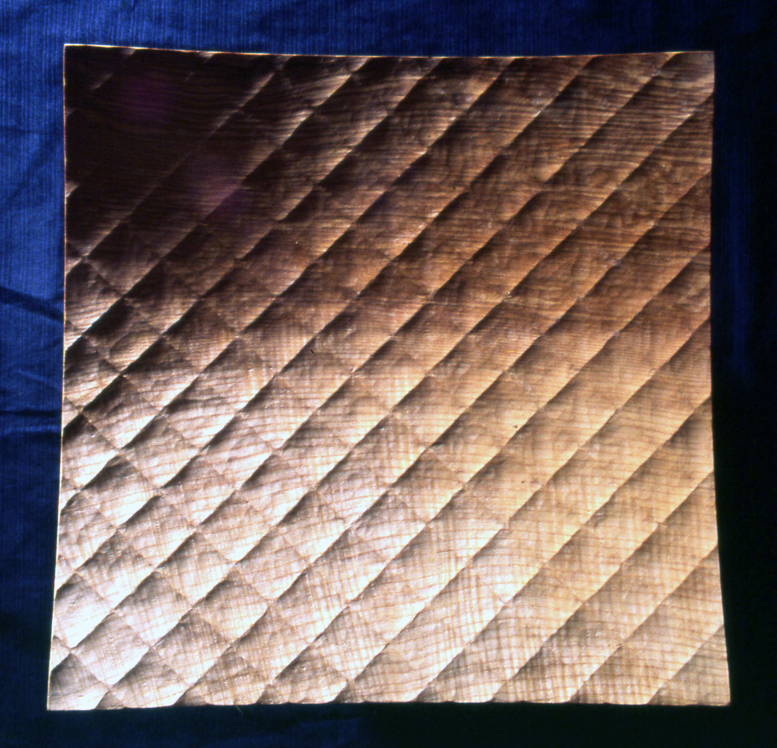 Platter with quilted pattern.