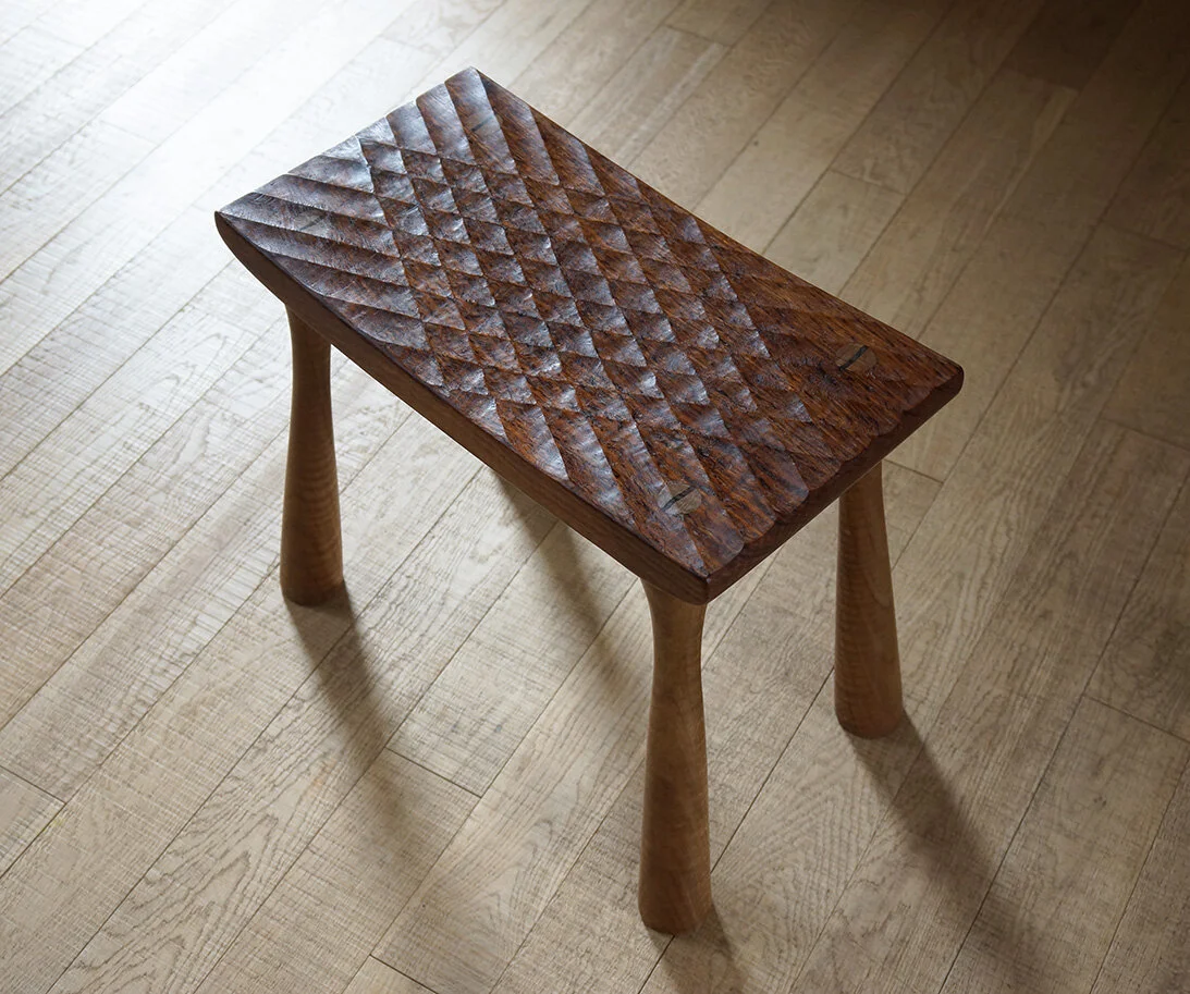Carved stool from Brown Oak with a diamond pattern