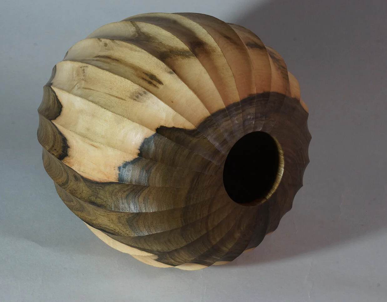 Turned and carved Walnut vessel
