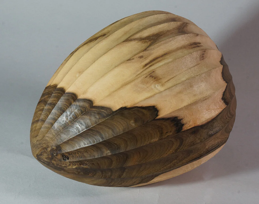 Turned and carved Walnut vessel.