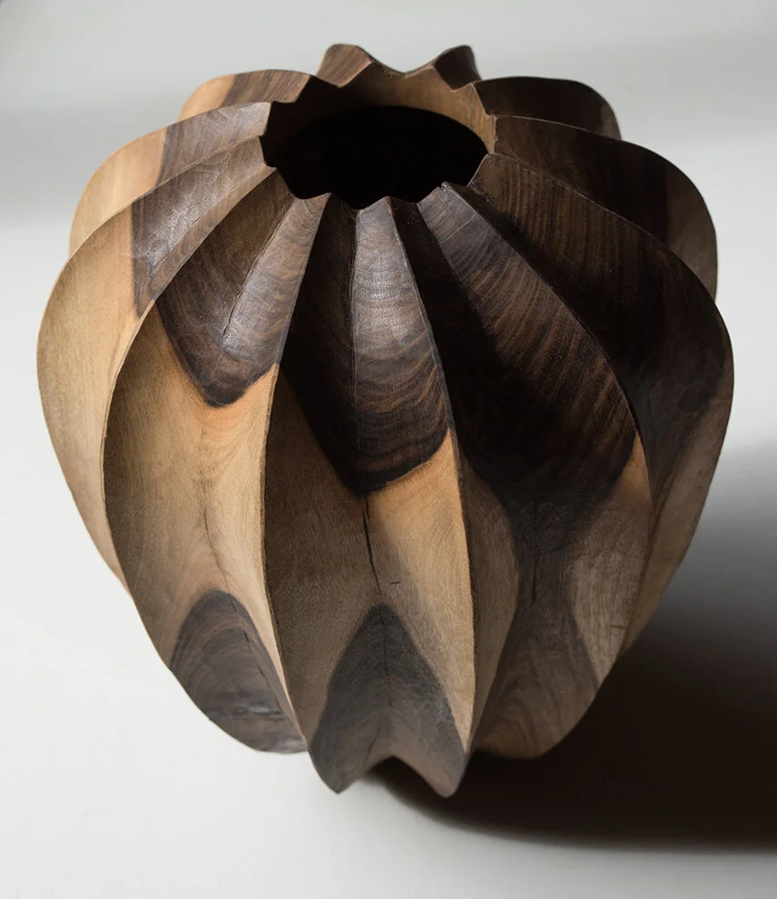 Turned and carved Walnut vessel