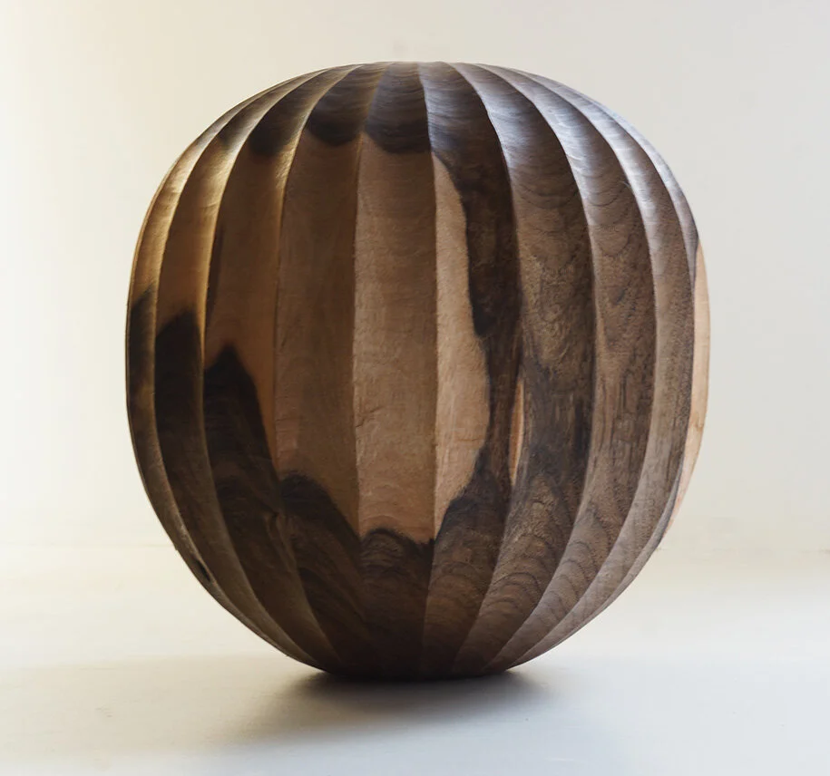 Turned and carved Walnut vessel