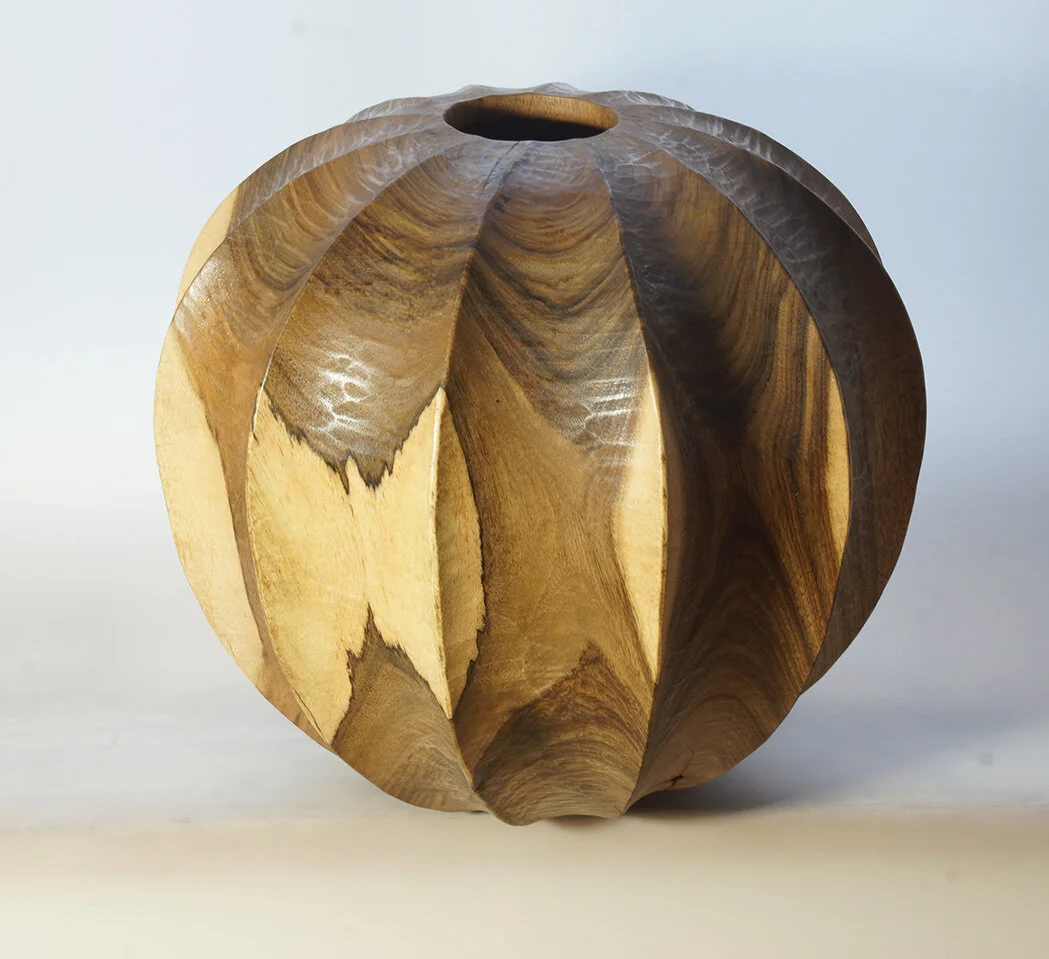 Turned and carved Walnut vessel