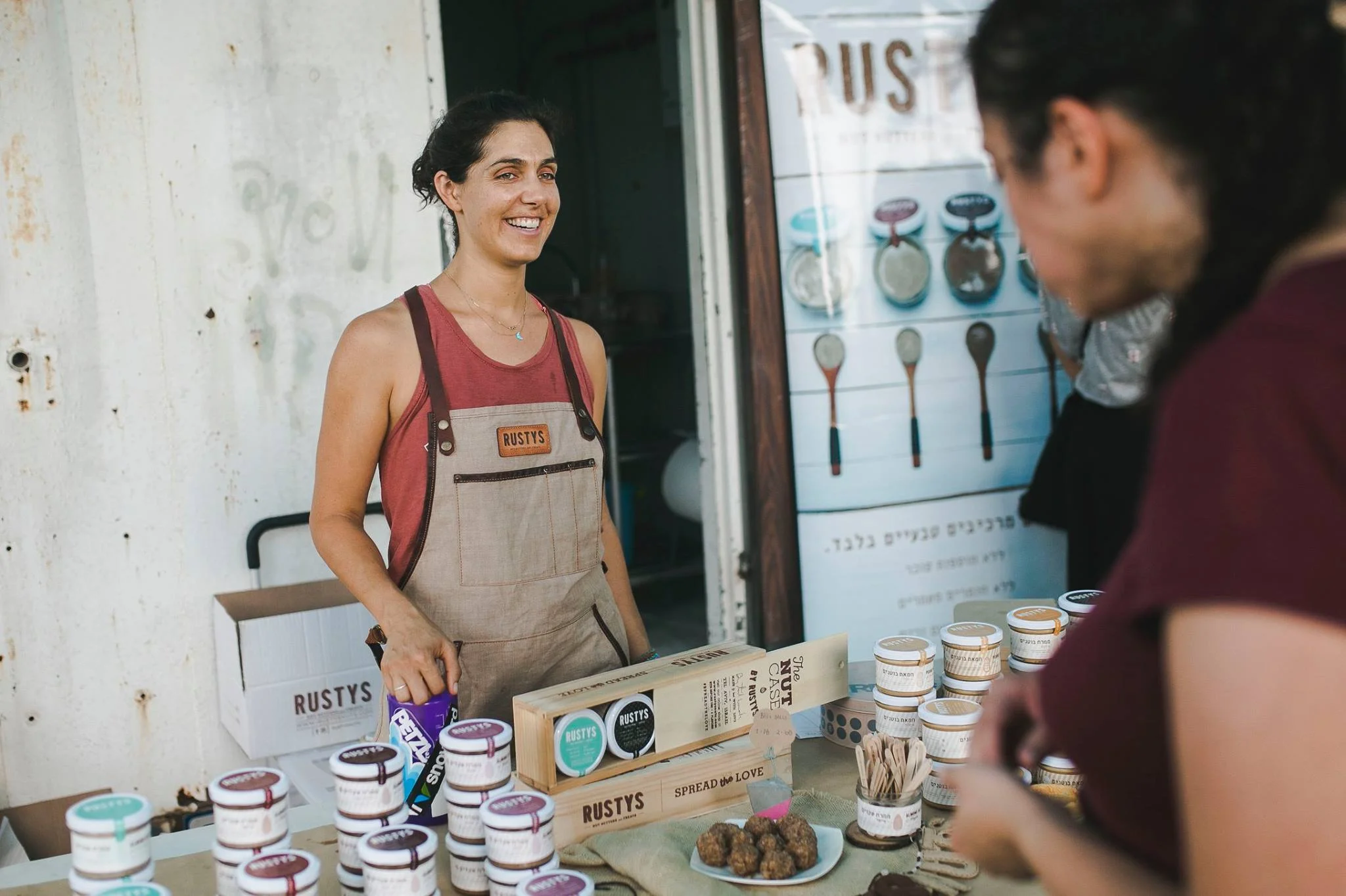 Beautiful Tal selling her wares at a local market