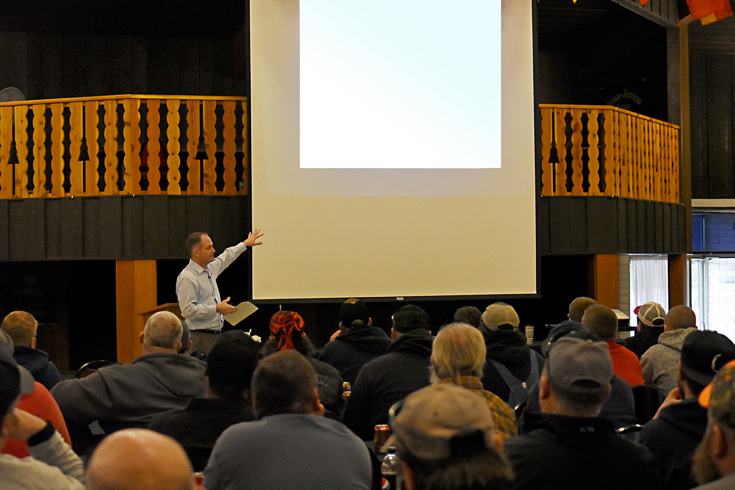 Photo by BRADY JONES/Lyman-Richey Communications Vice President of Administration Jeff Gromowsky discusses benefits with employees at the Omaha spring refresher meeting.