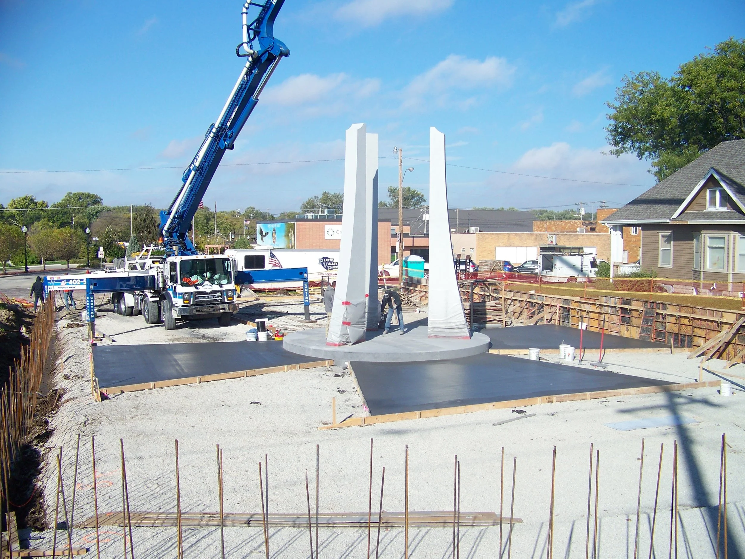 Photo courtesy of the American Veterans Park Darker colored concrete was used to inlay a large cross in the foundation of the park.