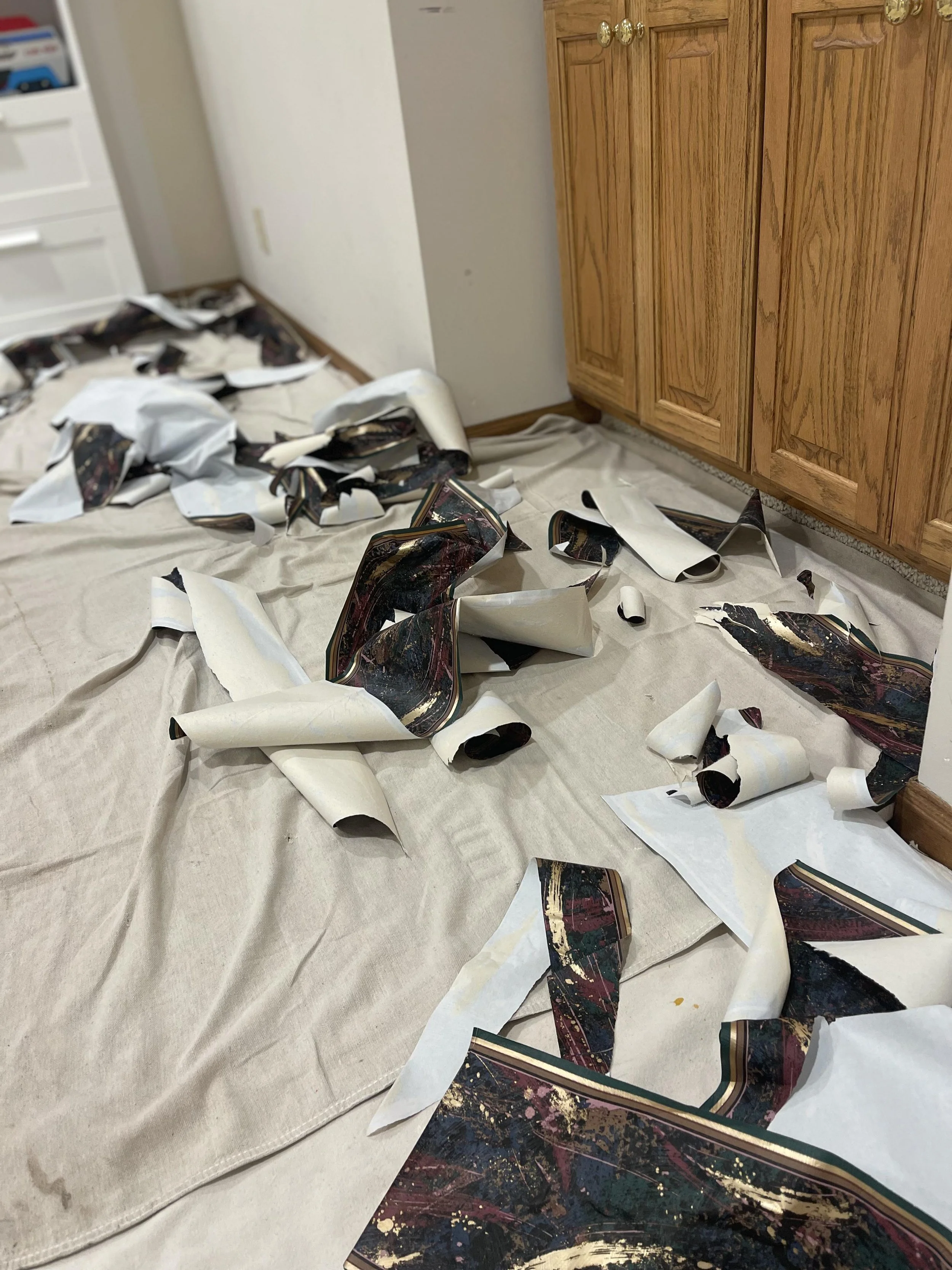Wallpaper that ahs been removed from the wall of a home by The Paper Puller in Lincoln, NE