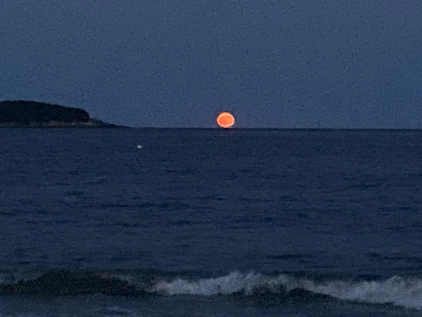 Found Color |  the Sturgeon Moon is an orange orb as it rises on the horizon: a complimentary color to the deep navy profile of House Island and the indigo blue of Manchester Bay