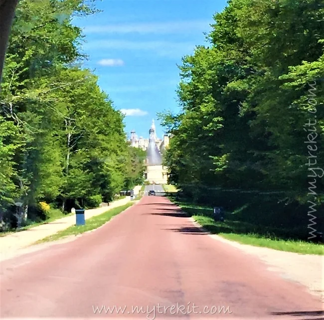 Approach to the car park with the sheer mass of castle in the distance.