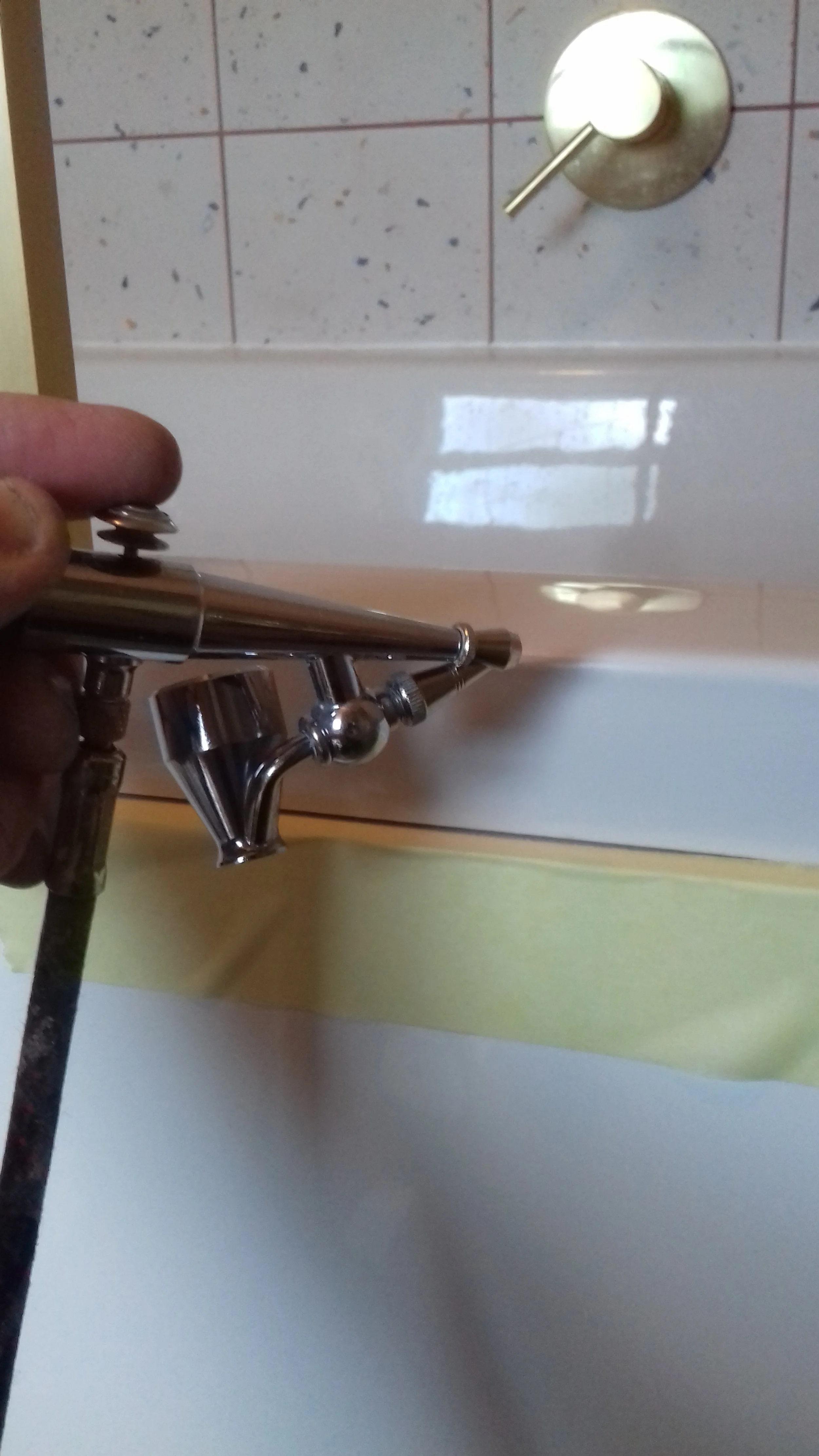 Repairing a damaged bath using an airbrush