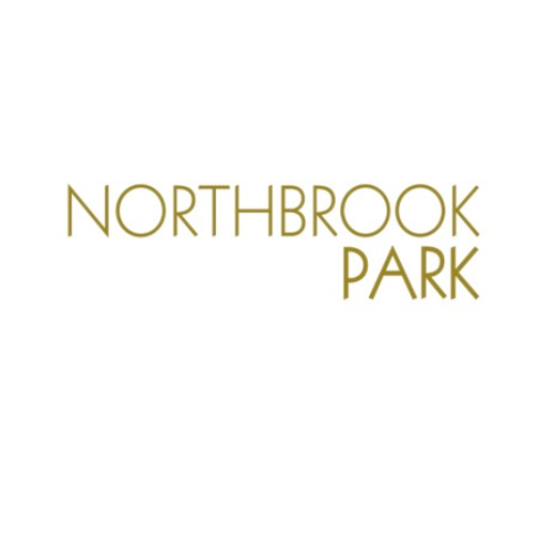 Logo for Northbrook Park with gold text on a white background.