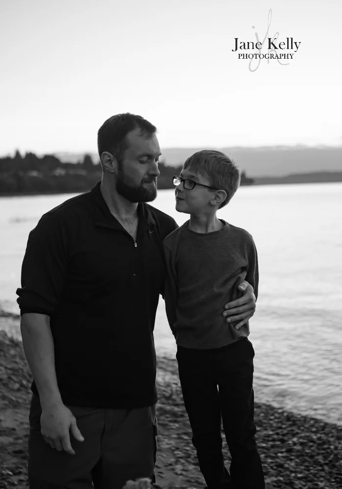 dad and son on a summer night on snohomish county beach