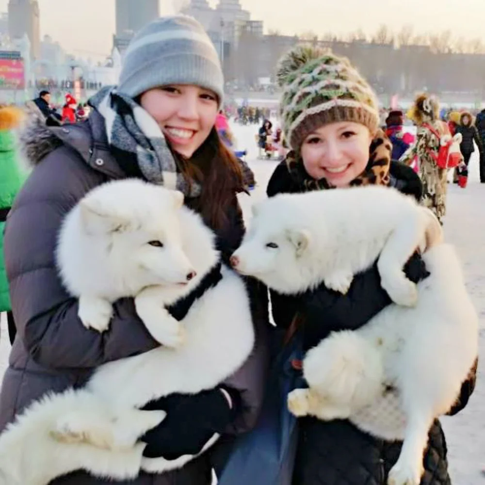 Snuggling for warmth at the frigid – but dazzling – Harbin Ice Festival.