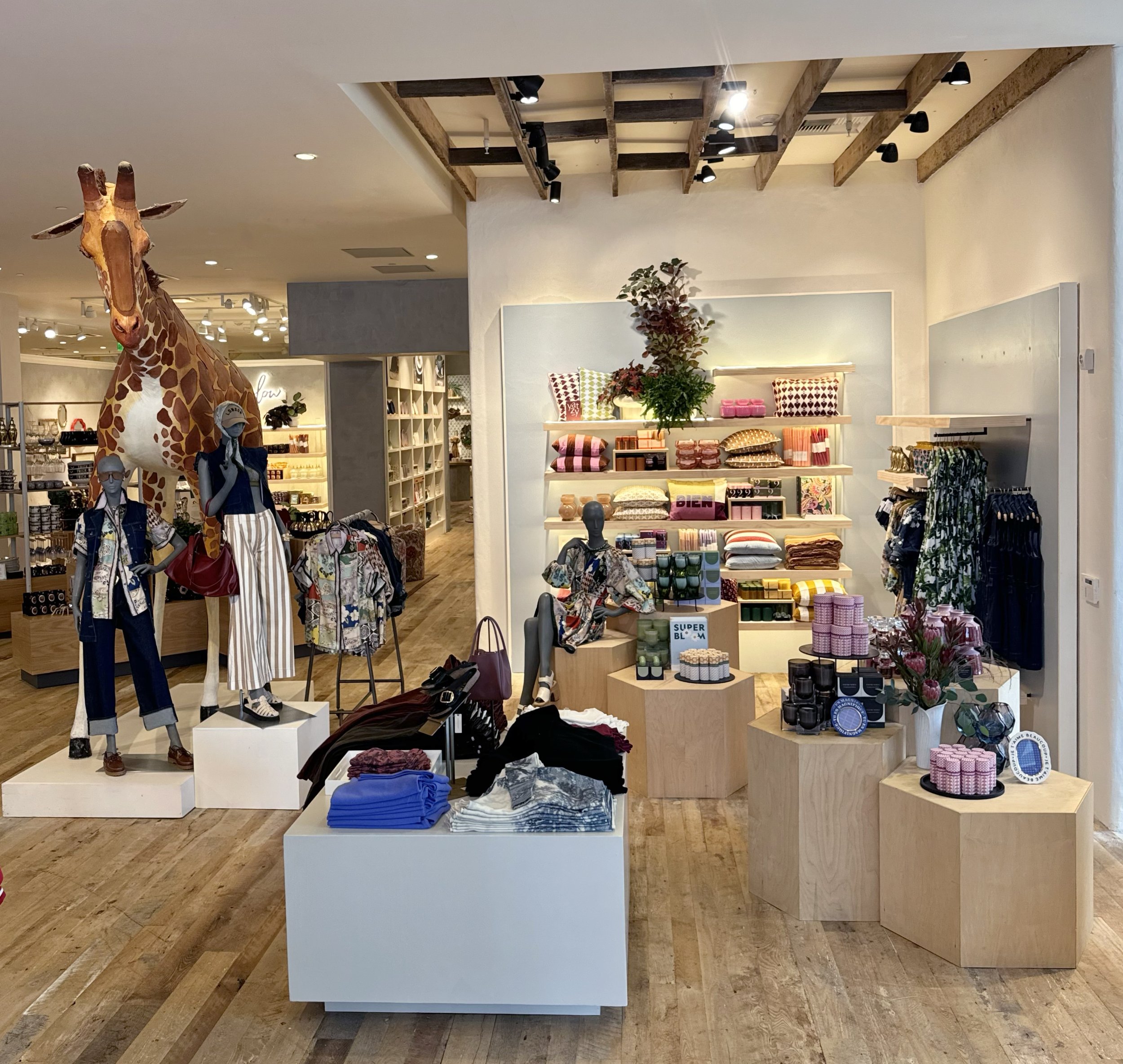    Anthropologie Fall ‘25 Interiors:    Custom vignette walls built and framed out. Custom lit and lipped shelves built. Large cubes built to support apparel. Small risers built to support merchandise. 