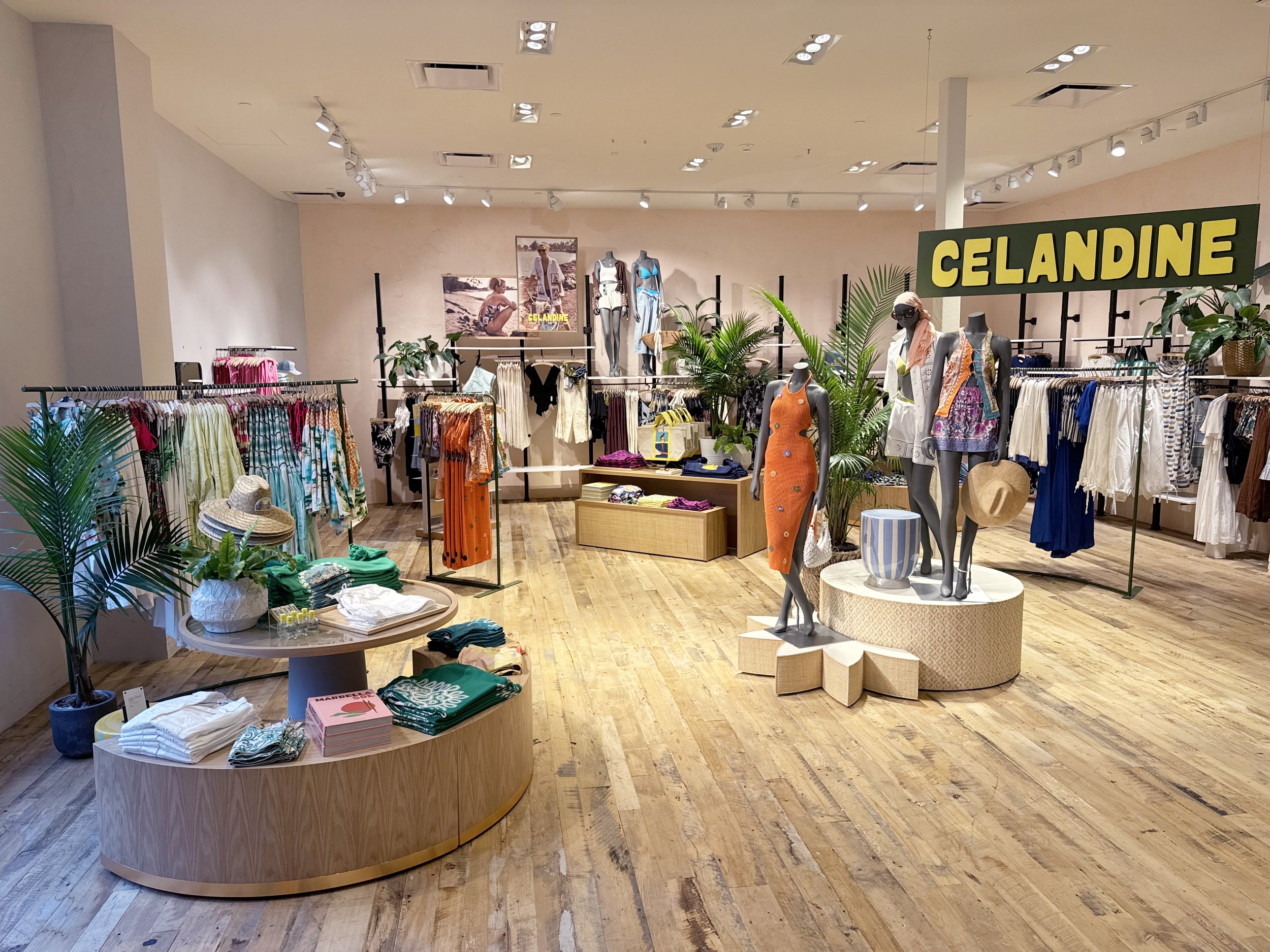    Anthropologie Fall ‘25 Interiors:    Custom star shaped and round nesting mannequin stands, wrapped in rattan. Accompanied by wooden hanging sign. 