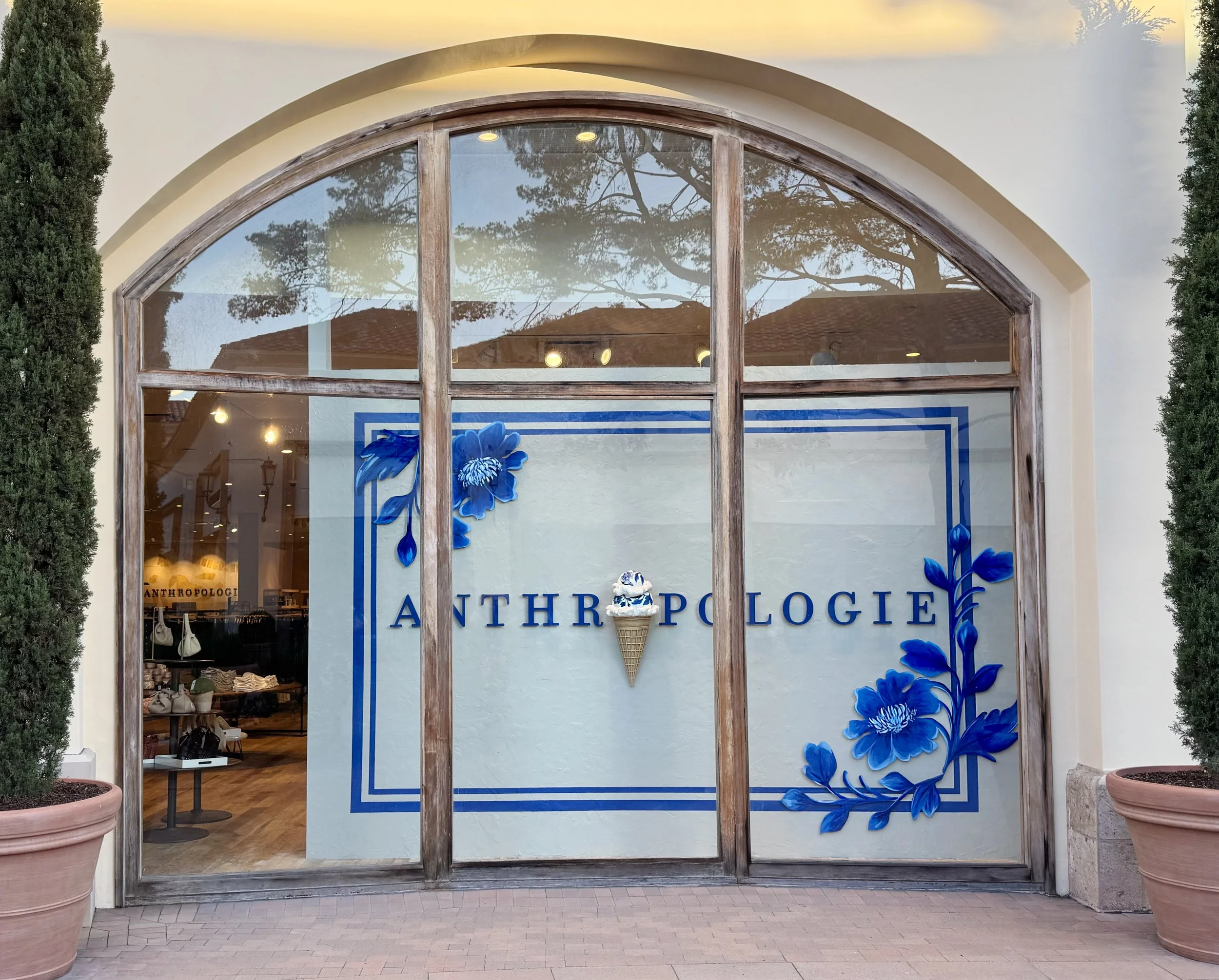    Anthropologie Summer ‘26 Window:    Oversized ice cream cone sculpted from foam and ram board. Hand painted delft elements. 