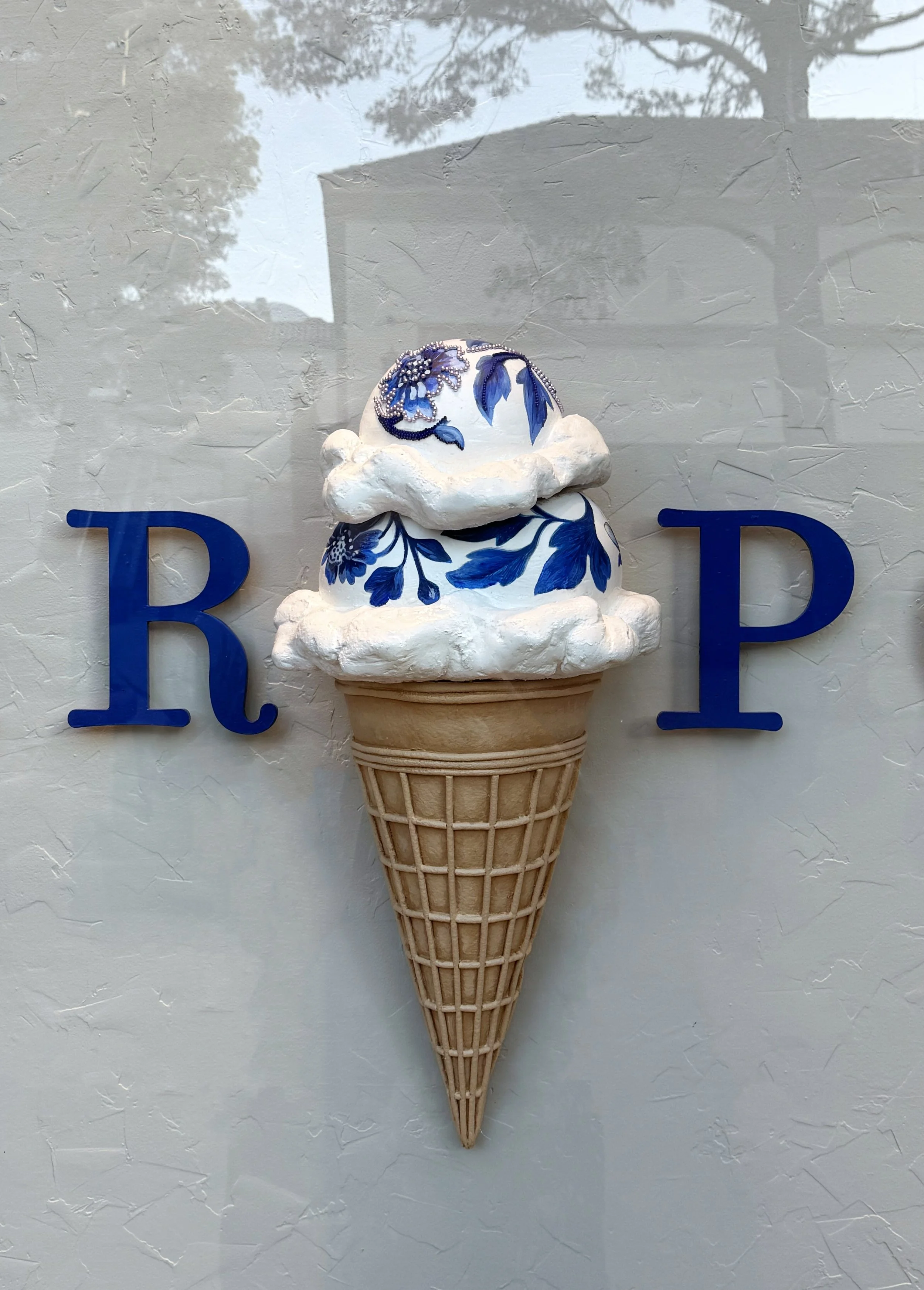    Anthropologie Summer ‘26 Window:    Oversized ice cream cone sculpted from foam and ram board. Hand painted delft elements. 