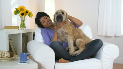 stock-footage-happy-african-american-woman-with-pet-dog.jpg