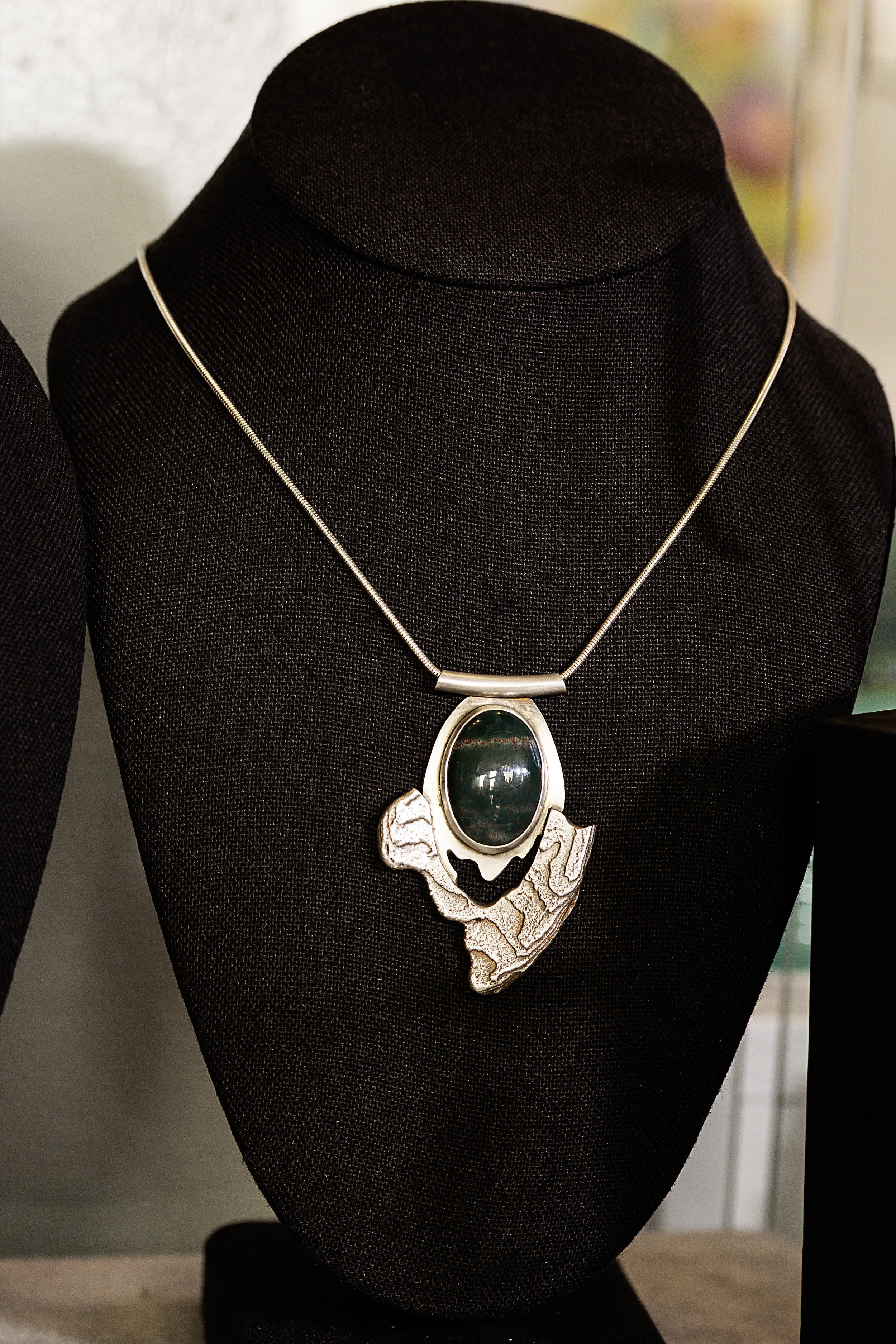 Colgrove_pendant green_Jan 2026.jpg