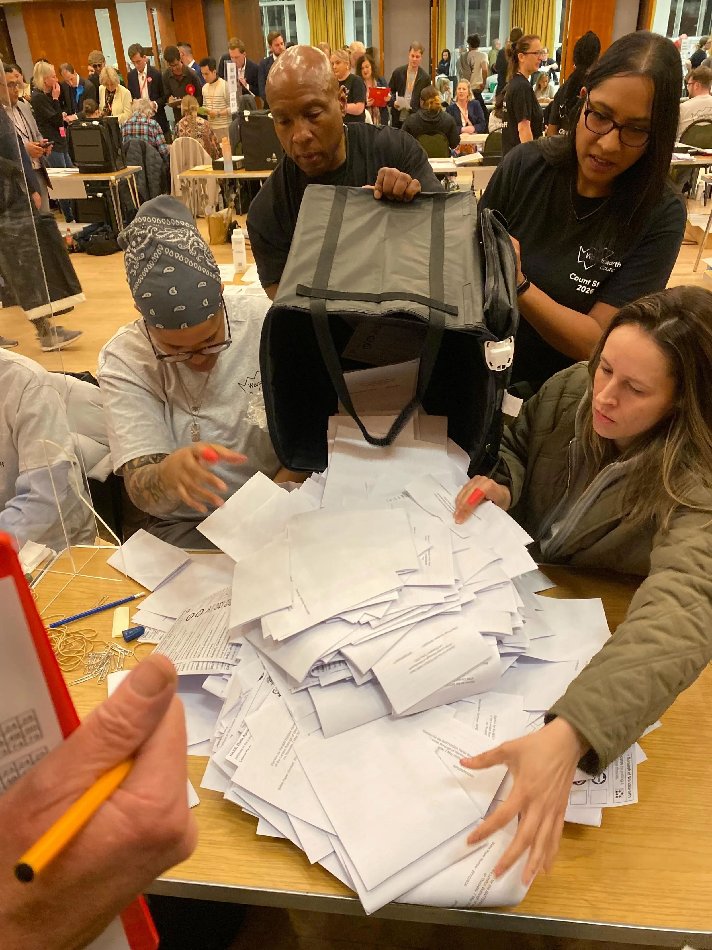 The count goes on all night. I left at midnight to come home and sleep. No staying power - me. 
1. The votes from Battersea Park Ward are tipped out
2. Seems the turn out wasn&rsquo;t too bad here. 
3. Every ward has their own table.
4 Special T shir