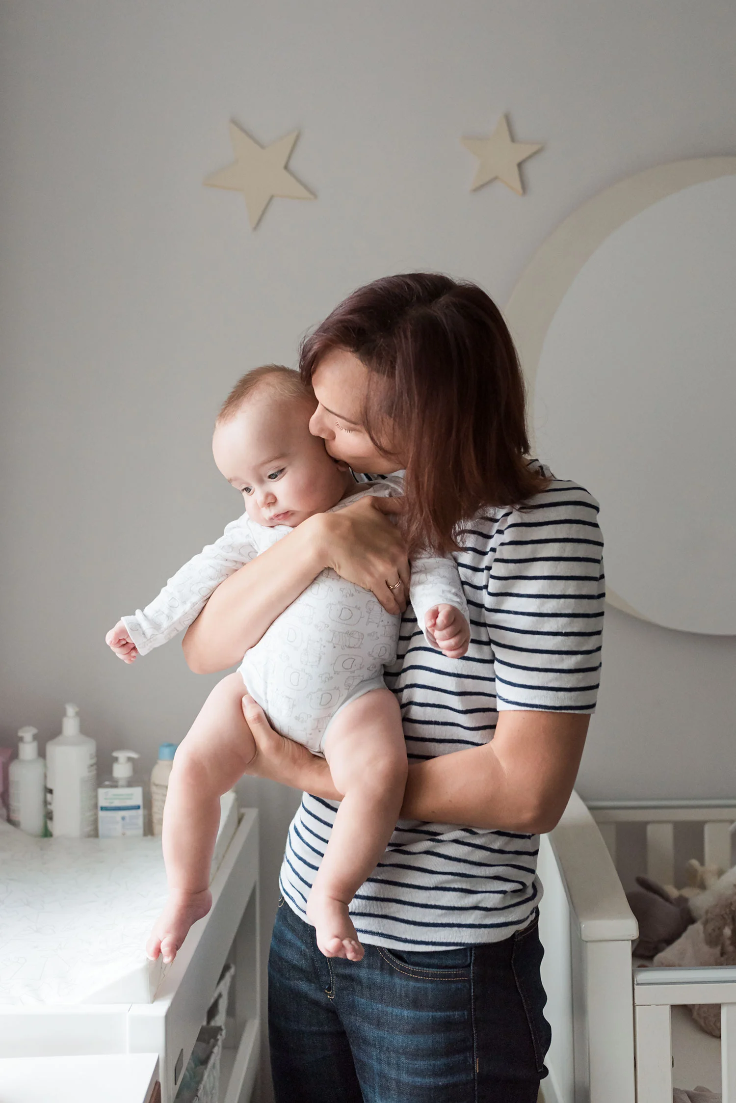Mom-kissing-baby-nursery-room.jpg
