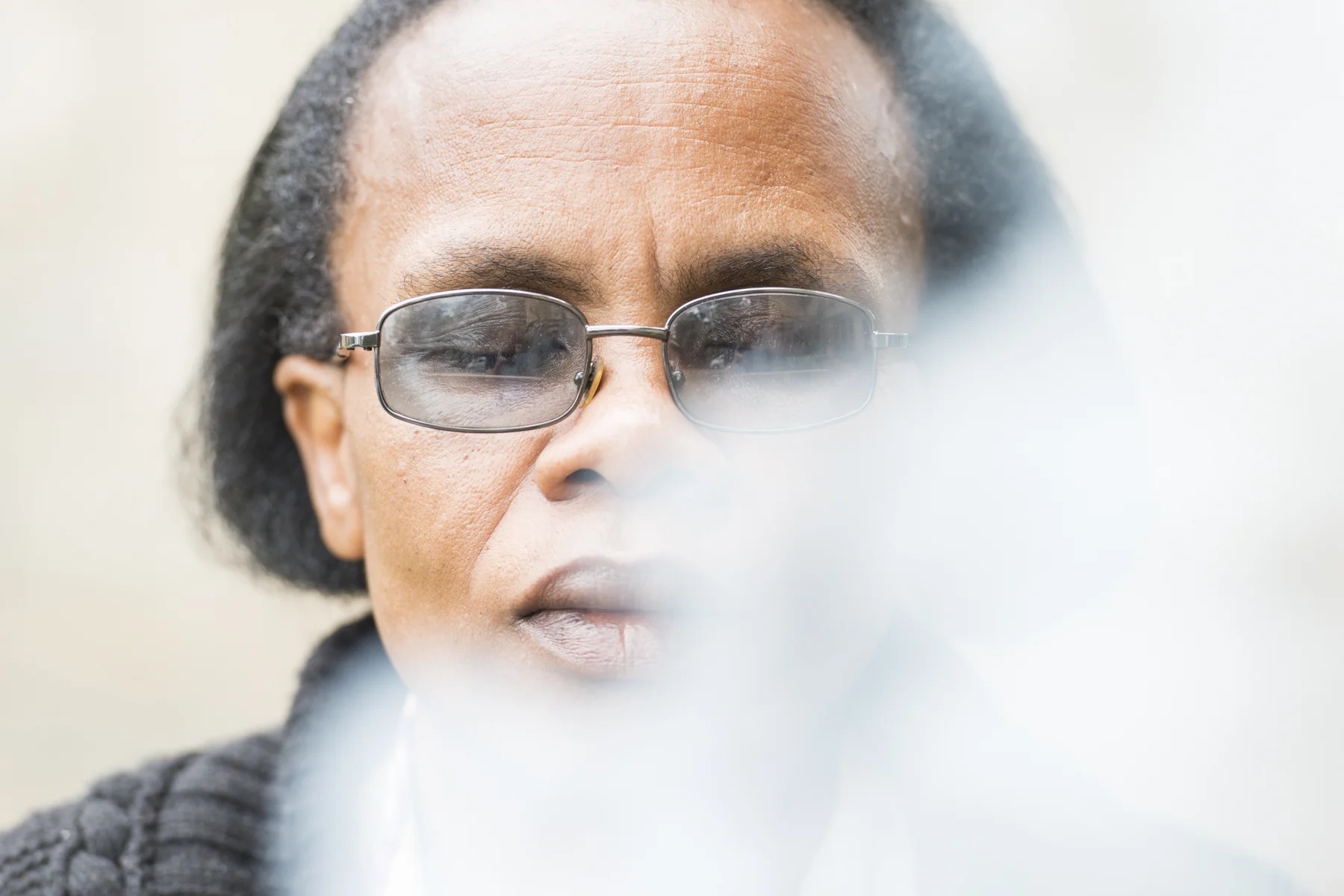 Appolinarie, a mother of two and Rwandan refugee based in Nairobi, meditates in the smoke of burning paper - paper that had her traumas and unforgiveness listed. It’s a key time of personal freedom found during the trauma healing course run by SIM in Nairobi.
