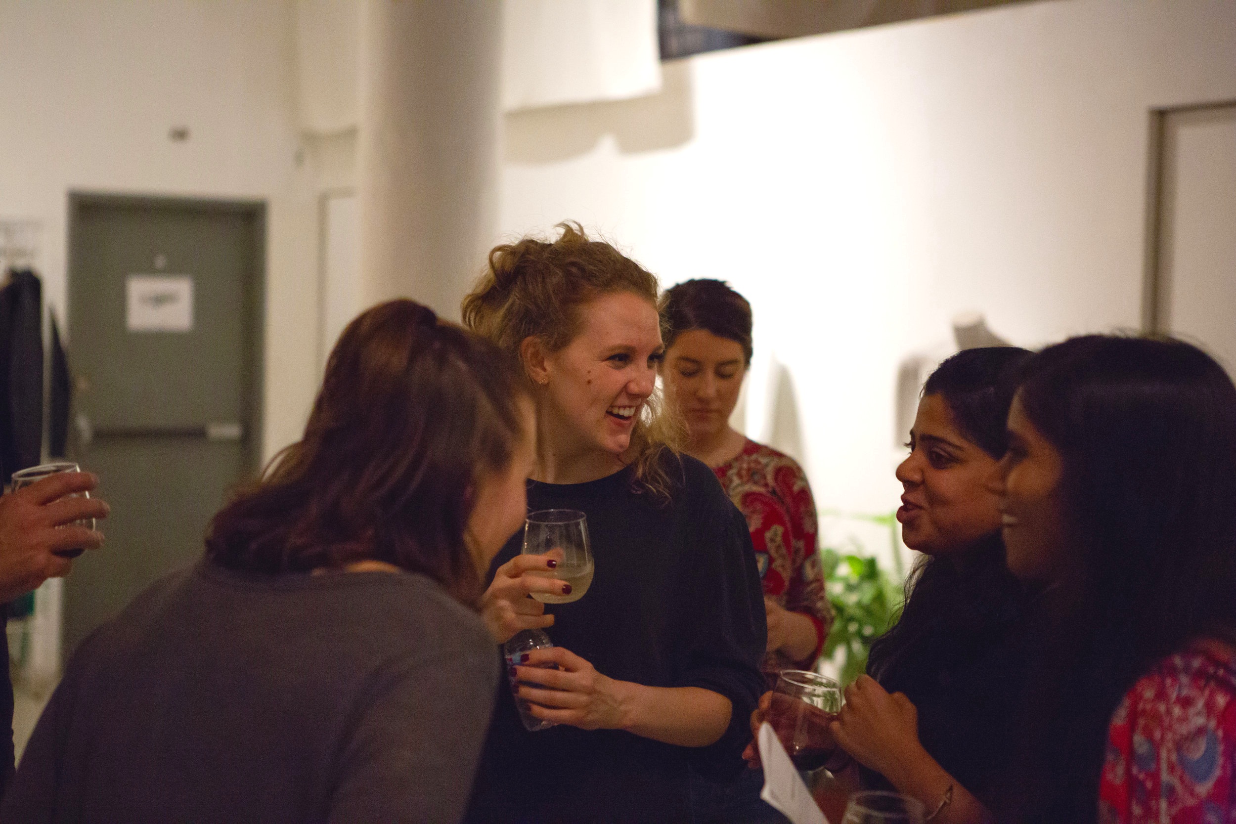 Dancers and audience members mingle during a Hi Artist private event.