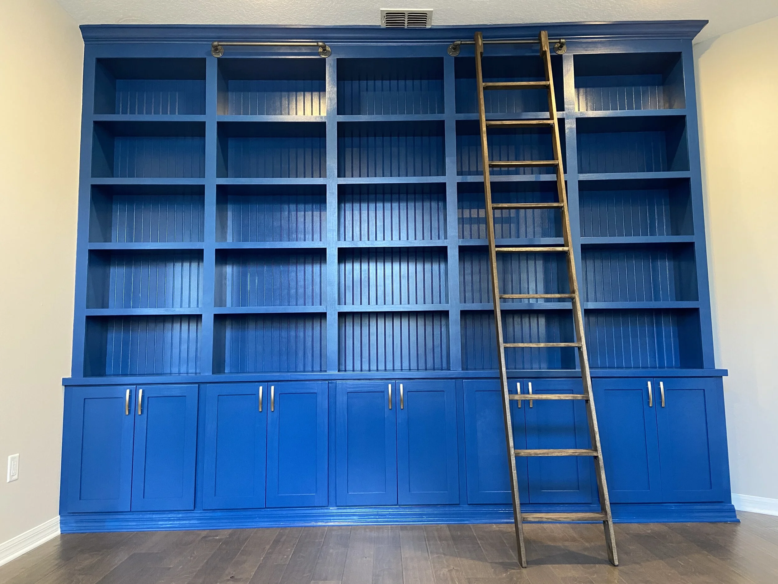 painted-caterpillar-custom-woodworking-blue-bookshelf.JPG