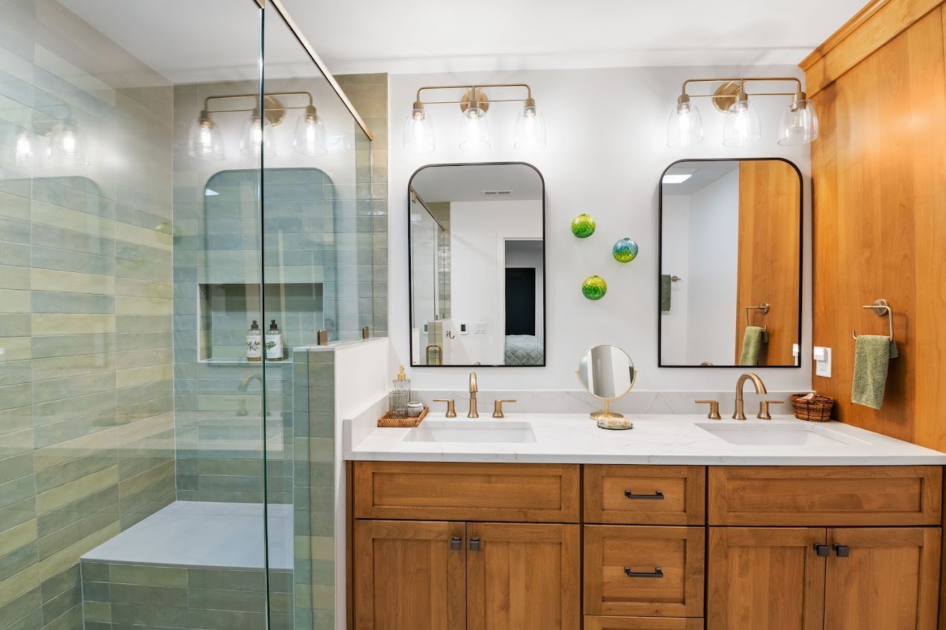 asheville-primary-bath-remodel-starmark-wood-vanity-quartz-countertop-arched-mirrors.jpg