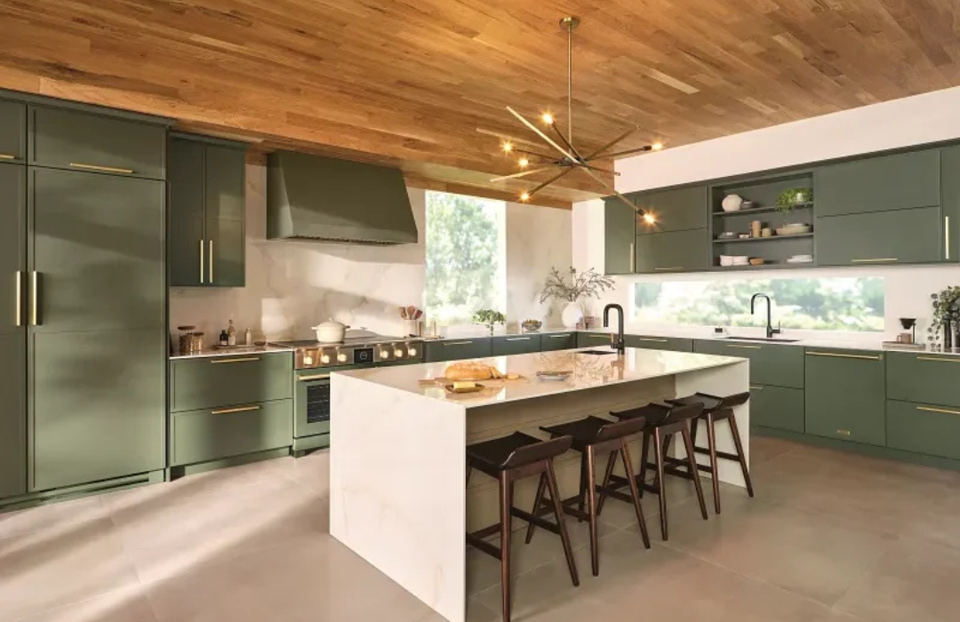 Kitchen with deep green cabinets, wood plank ceiling, and white quartz island
