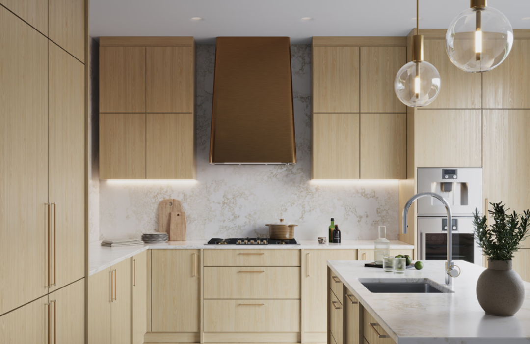 Quiet luxury kitchen with light wood slab cabinets, subtle veined white quartz countertops, under-cabinet lighting, minimalist hardware, and organic modern design showing quality materials investment