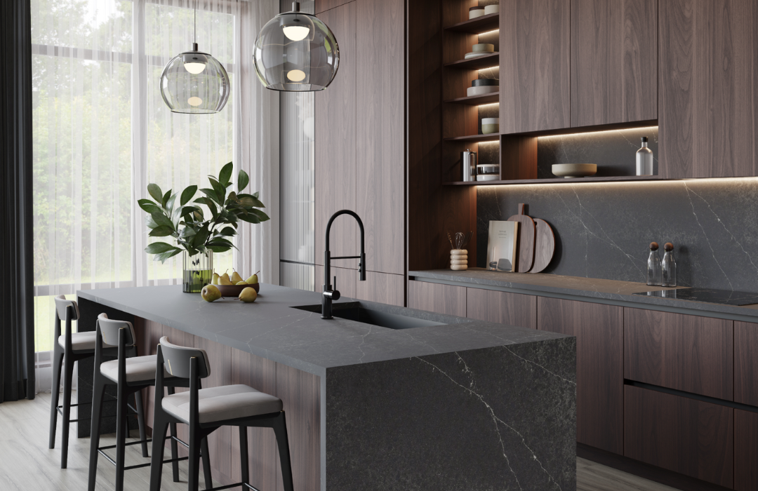 Modern quiet luxury kitchen with dark gray waterfall countertops, seamless wood grain cabinets, handleless design, integrated lighting, and dramatic pendant lighting creating sophisticated minimalist aesthetic