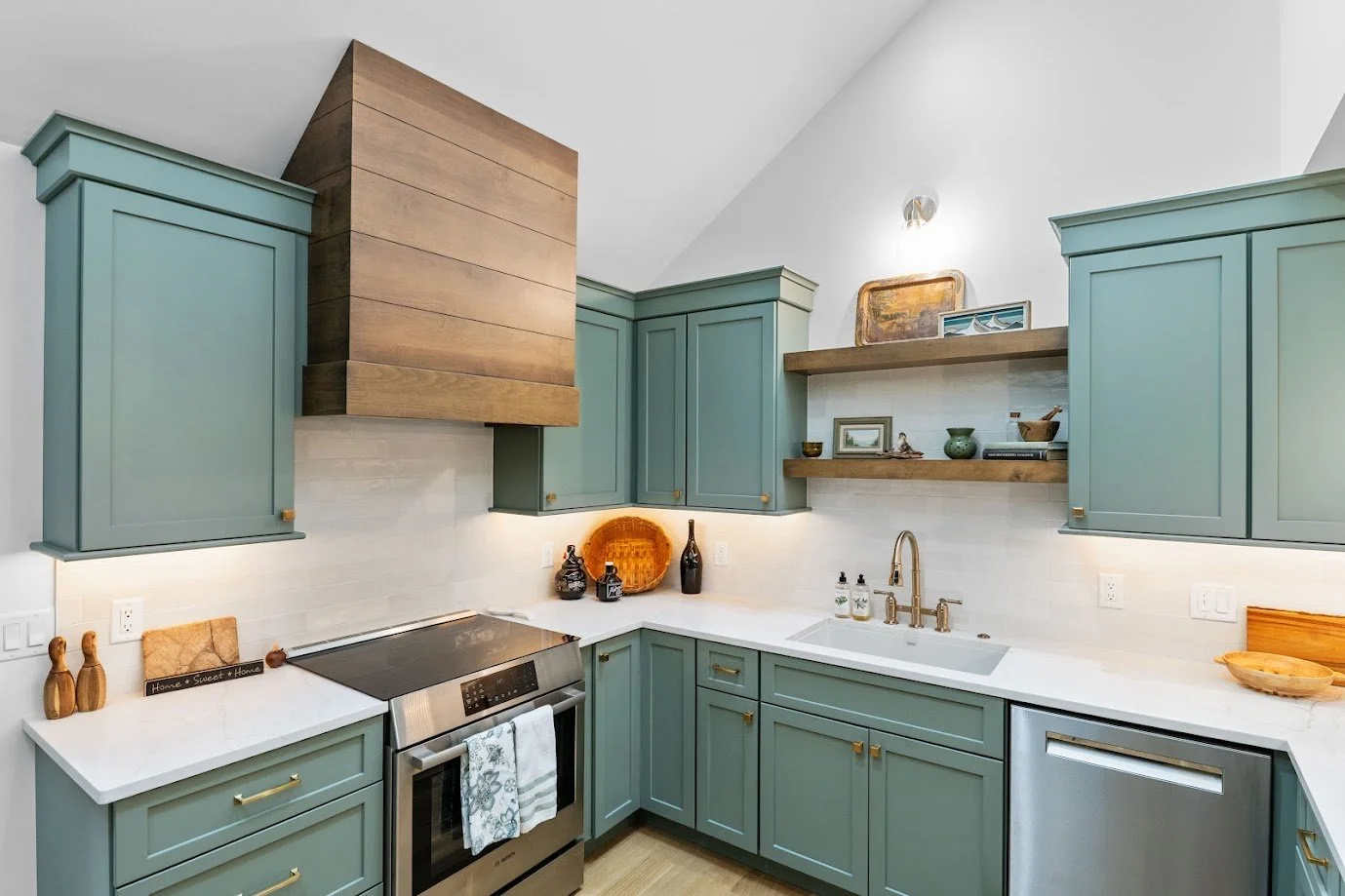 asheville-kitchen-wood-range-hood-starmark-sage-green-cabinetry-floating-shelves.jpg