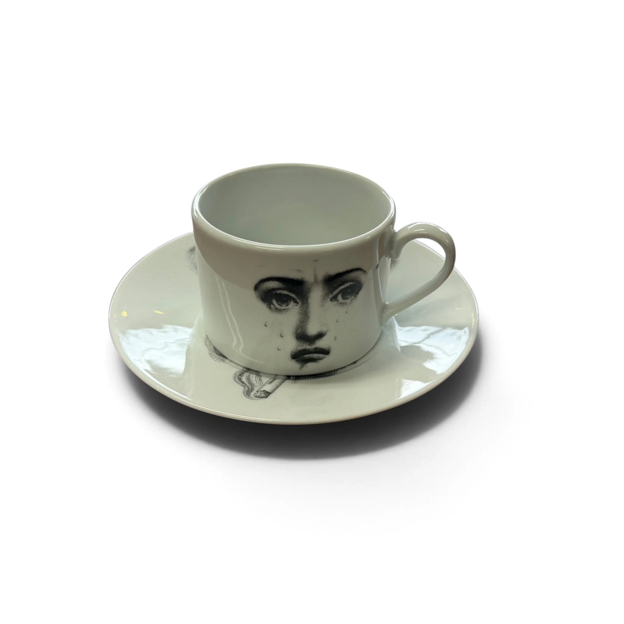 fornasetti-fornasetti-tema-e-variazioni-il-fumo-fa-male-tea-cup-saucer-1-1793127634551.jpg