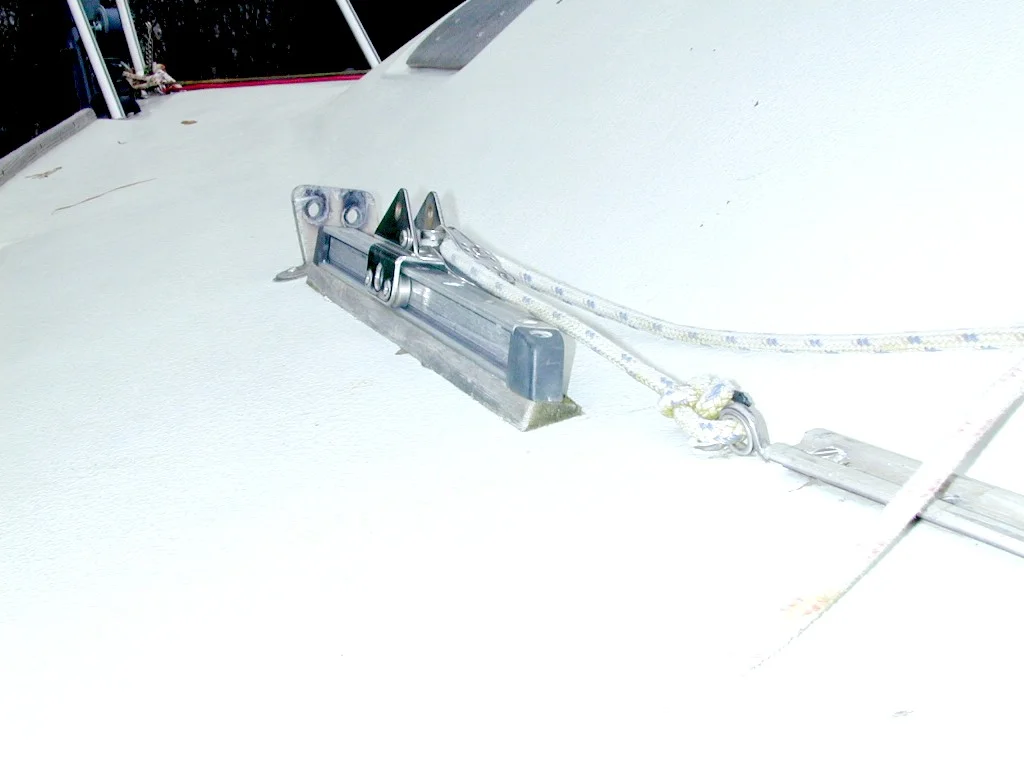 Aft lowers 3 - Track mounted on angled teak block to align track with shroud.