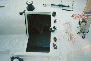 This shot shows more detail of the control console. Gone are the wood guides for the hatch cover. They have been replaced by a low profile fiberglas "lip" that will hold the hatch cover, but not break when you stand on it. Also missing here is the forward winch pedestals. They were removed since most folks don't use them.