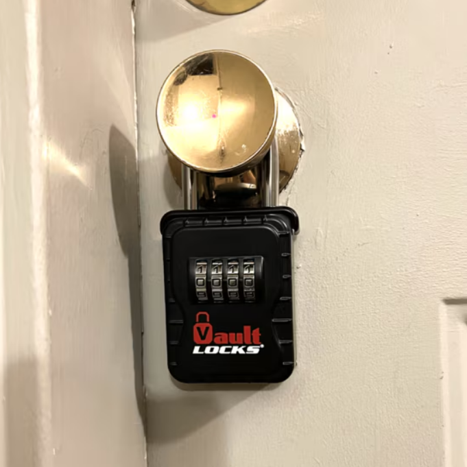Lock box attached to a front door handle