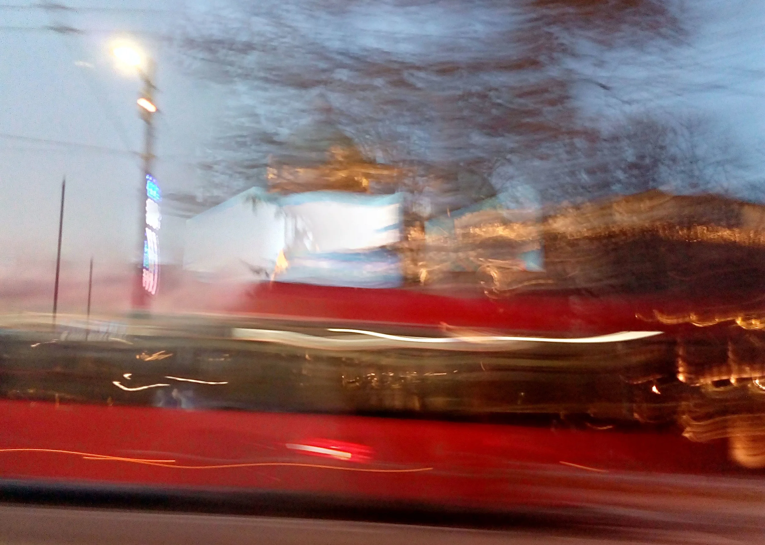 A bus zooming by, photo by Aleks