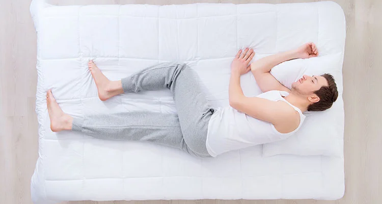 man-on-mattress-sleeping-on-side.jpg