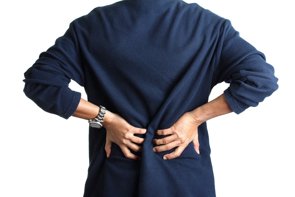 Illustration of discomfort in the lower back