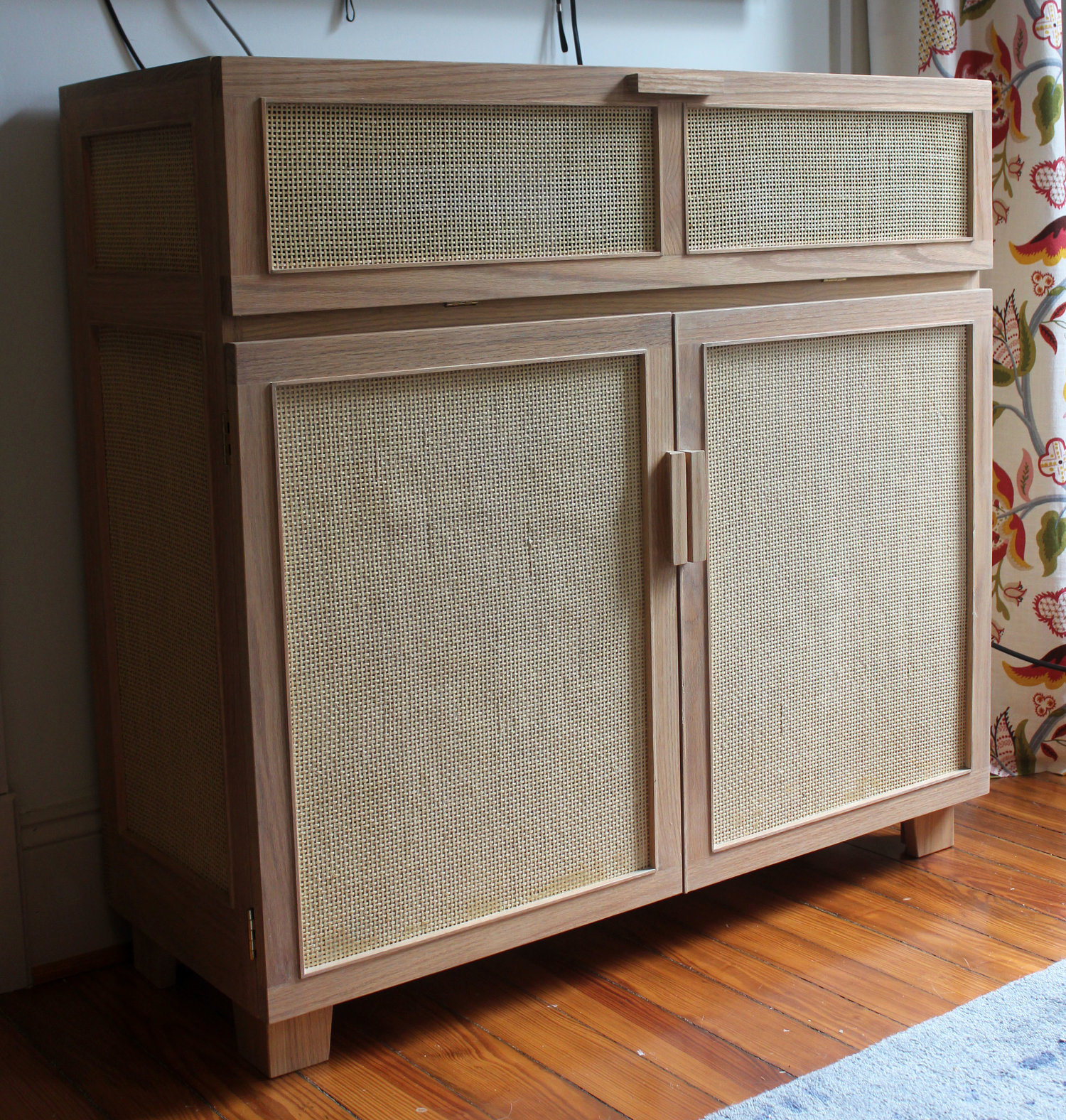 custom white oak media cabinet with cane
