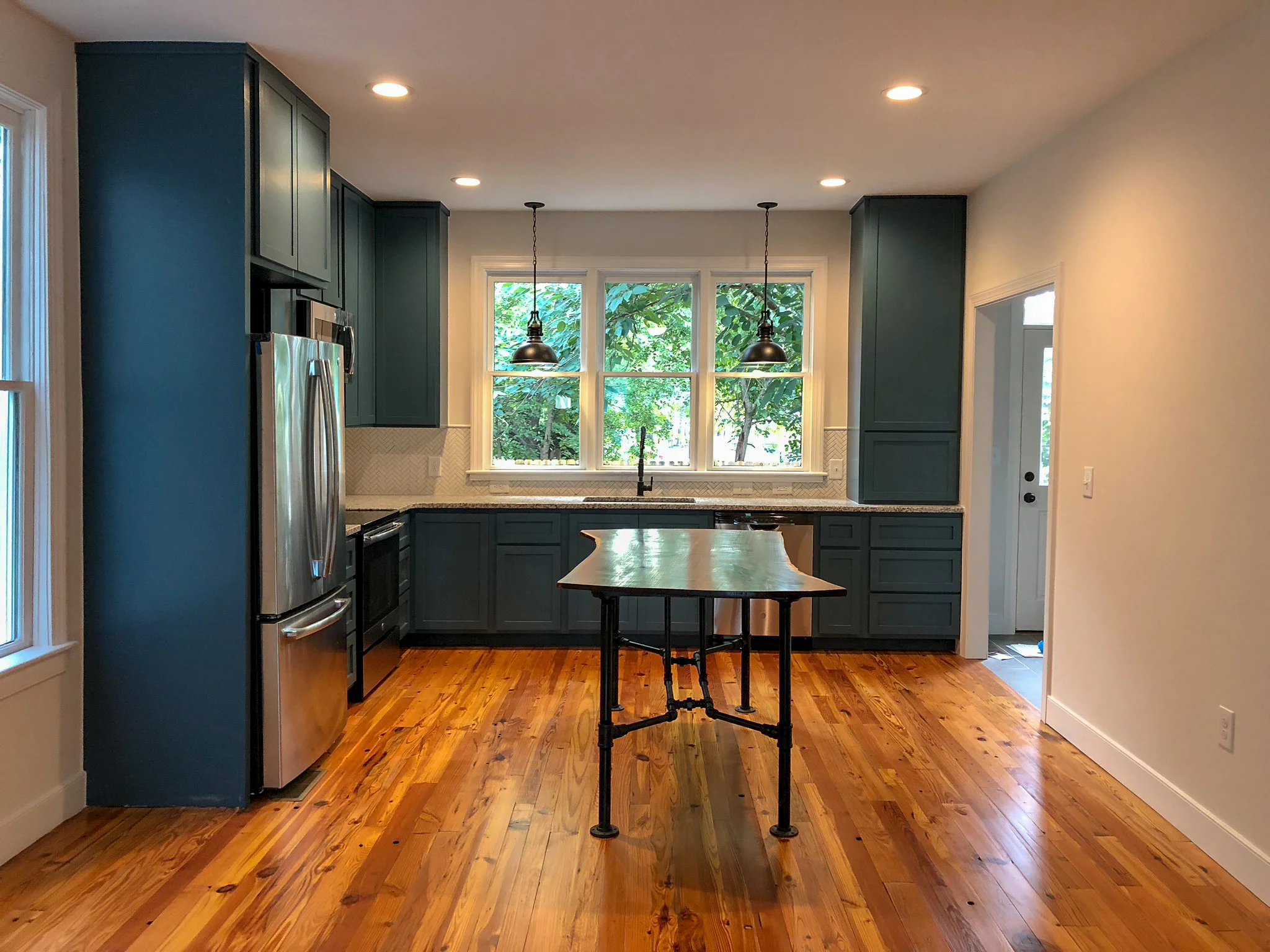 Custom Live Edge Walnut Kitchen Island with Black Pipe Legs Sallie Plumley Studio Richmond Virginia Sally Plumley Custom Woodworking and Furniture Design