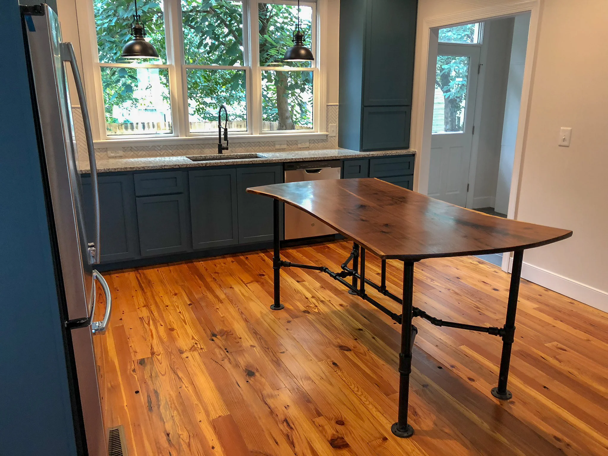 Custom Live Edge Walnut Kitchen Island with Black Pipe Legs Sallie Plumley Studio Richmond Virginia Sally Plumley Custom Woodworking and Furniture Design
