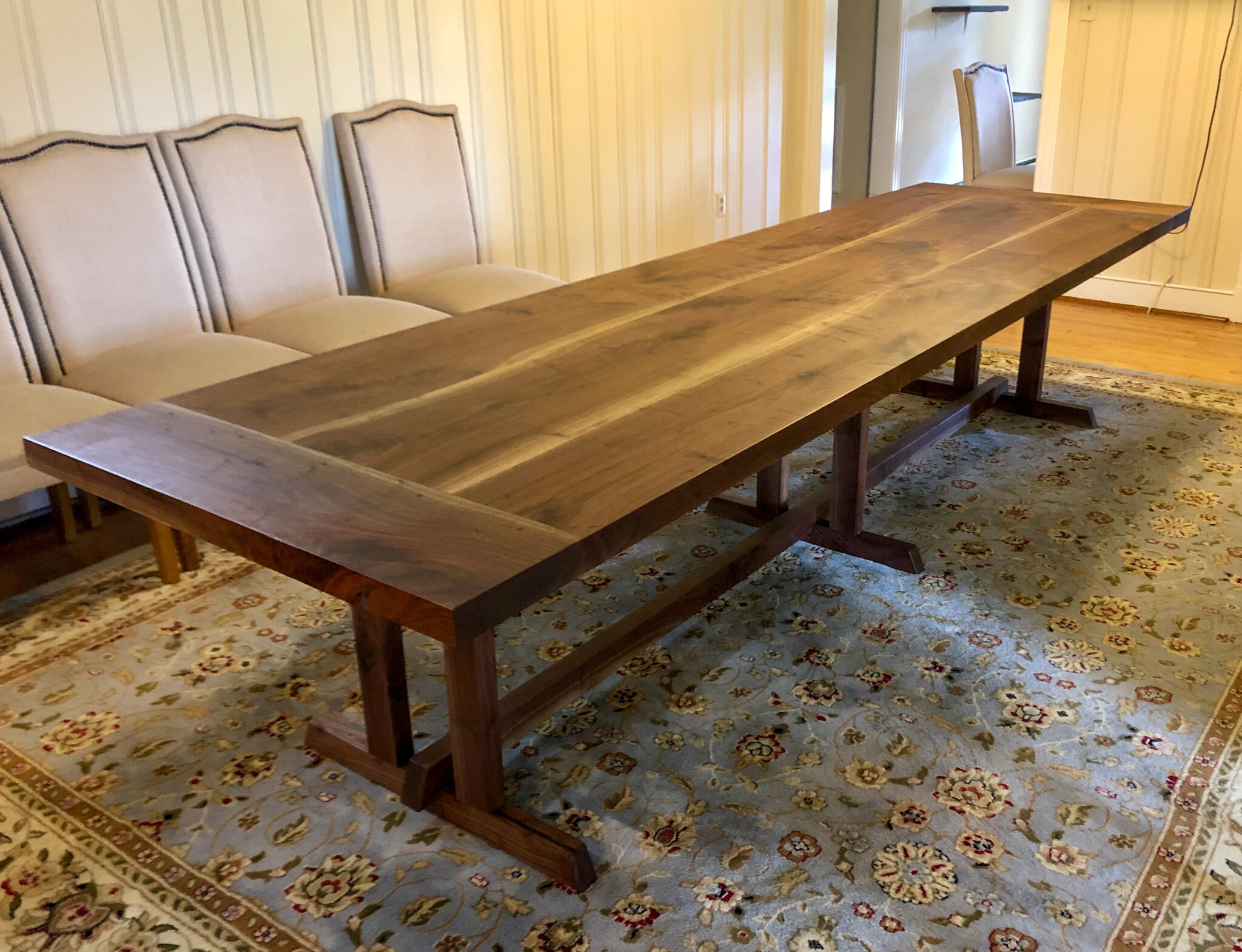 11 foot walnut trestle table with breadboard end and blue epoxy details. Sallie Plumley Studio richmond Virginia 