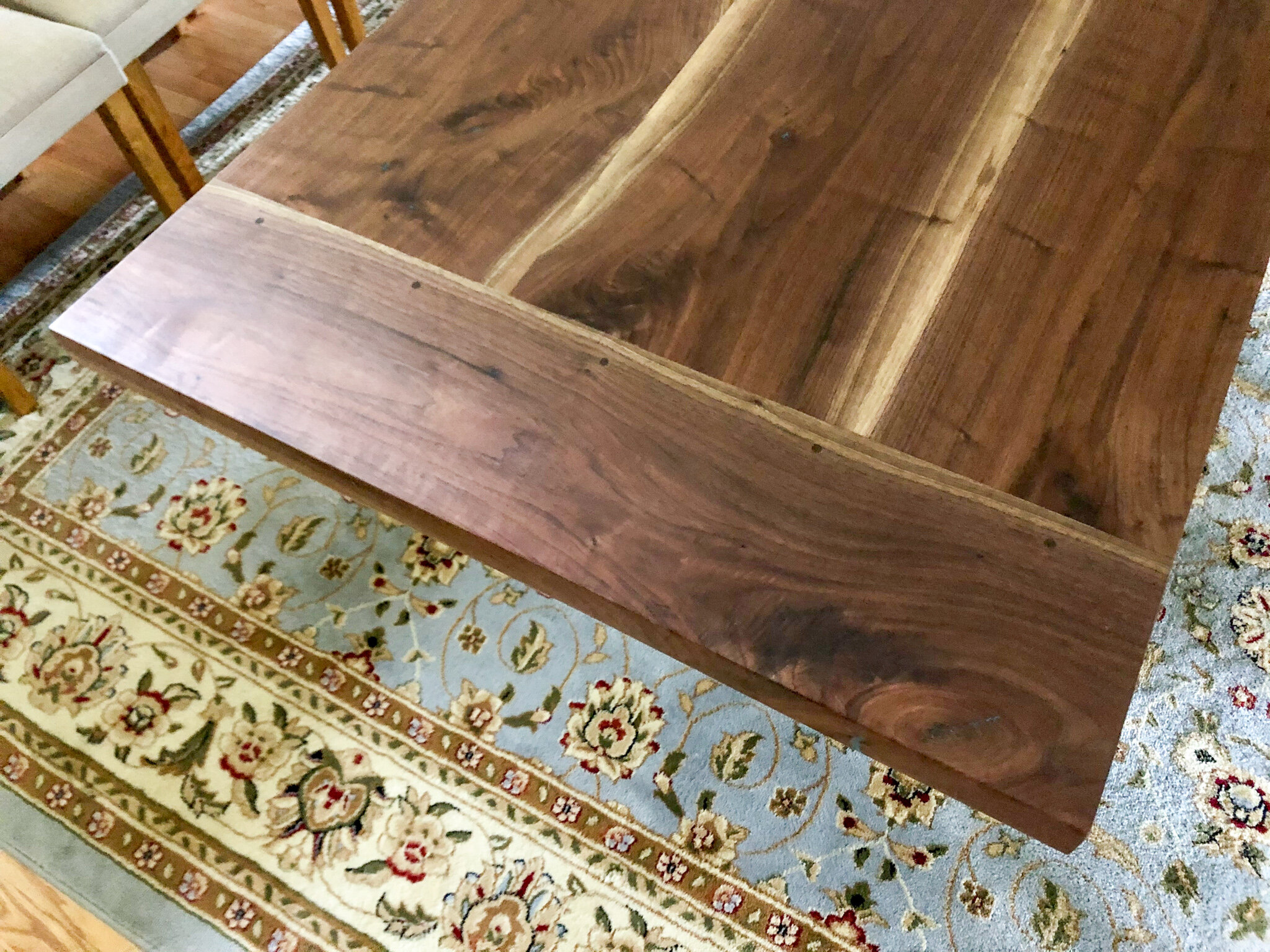 11 foot walnut trestle table with breadboard end and blue epoxy details. Sallie Plumley Studio richmond Virginia 