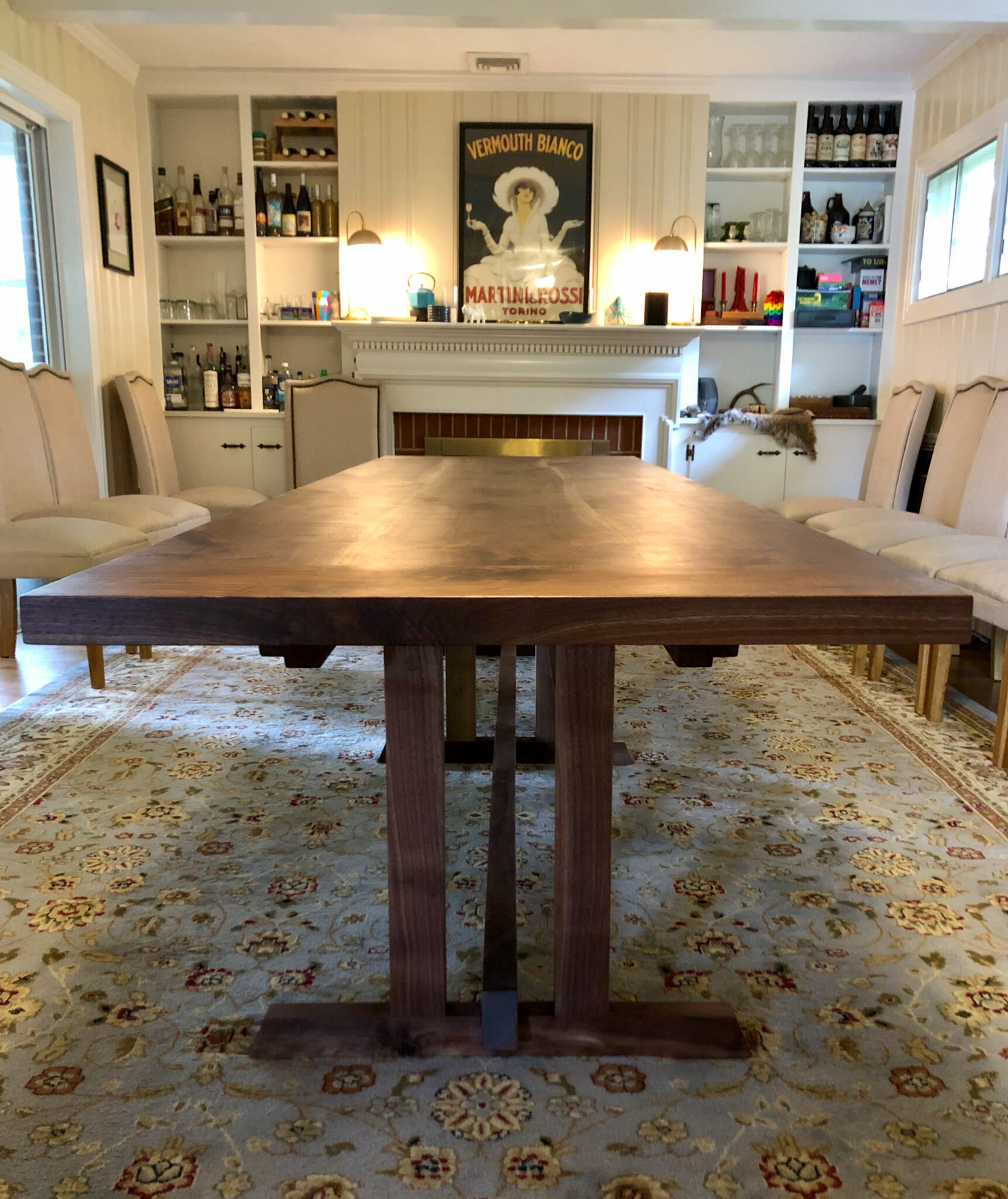 11 foot walnut trestle table with breadboard end and blue epoxy details. Sallie Plumley Studio richmond Virginia 