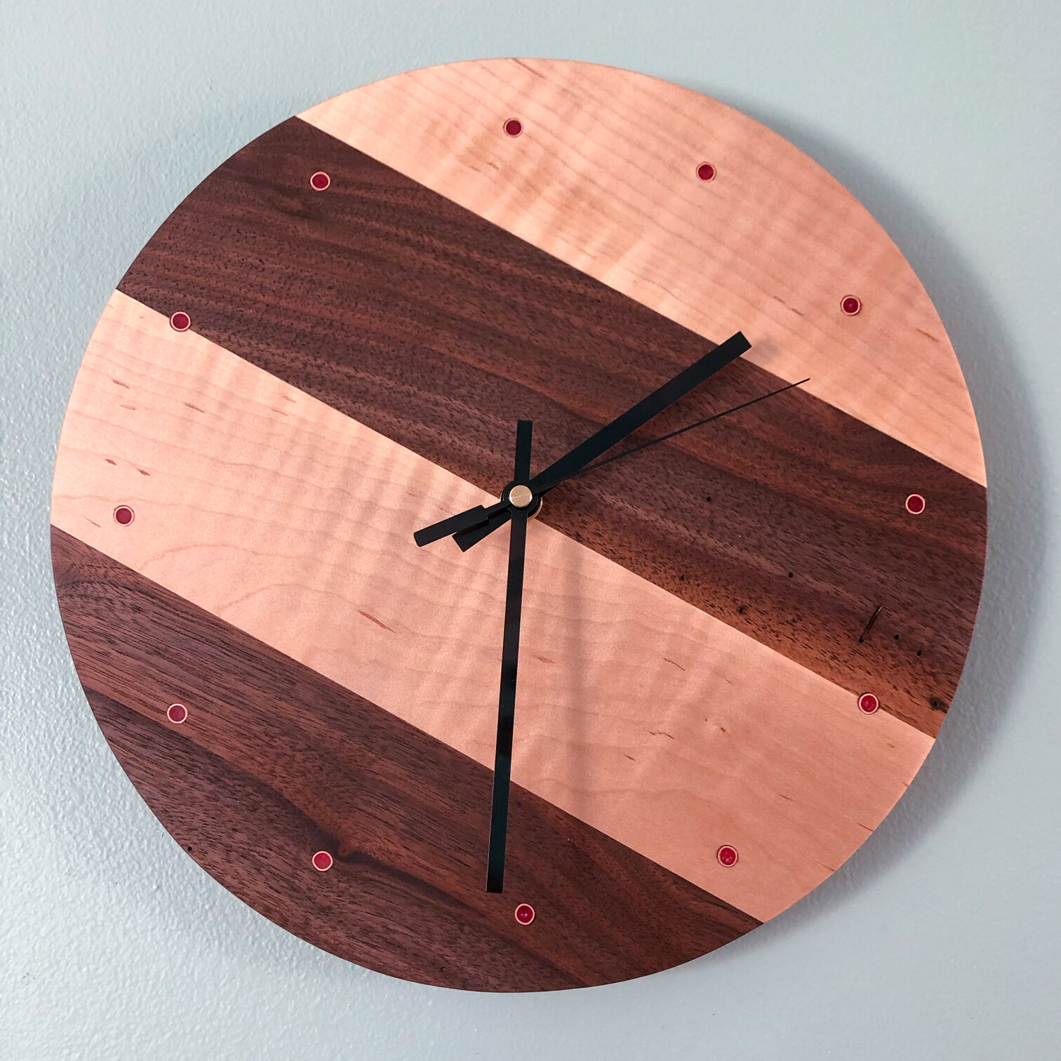 walnut and maple striped wall clock with pink epoxy