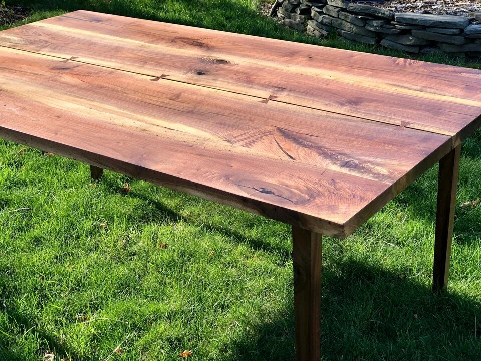 sleek walnut table with cracks and bow ties 